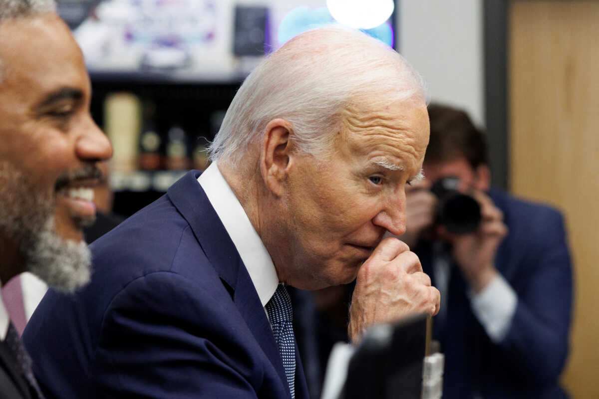 U.S. President Joe Biden rubs his nose while greeting shoppers inside Mario's Westside Market grocery store in Las Vegas, Nevada, U.S., July 16, 2024. REUTERS