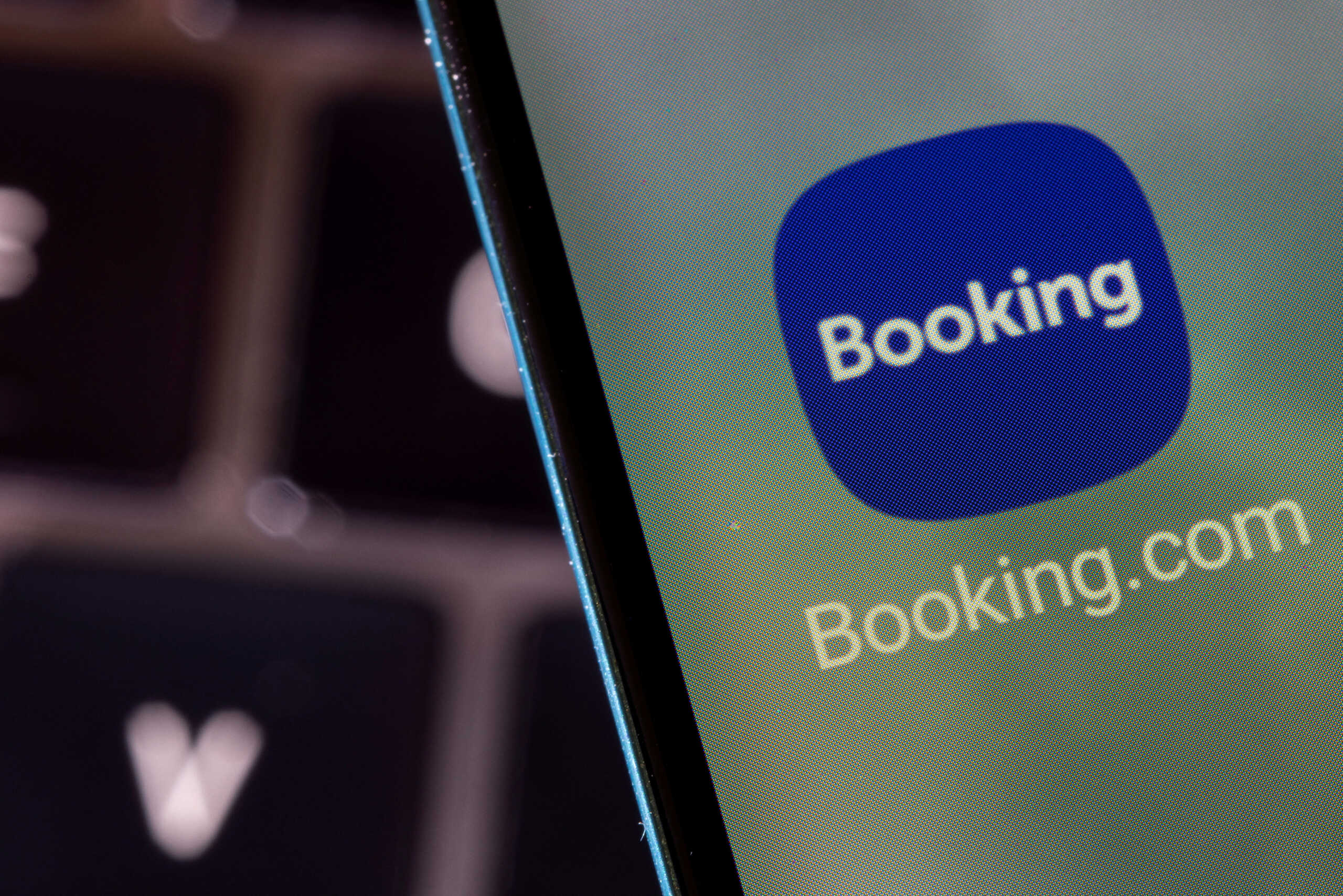 FILE PHOTO: Booking.com app is seen on a smartphone in this illustration taken February 27, 2022. REUTERS
