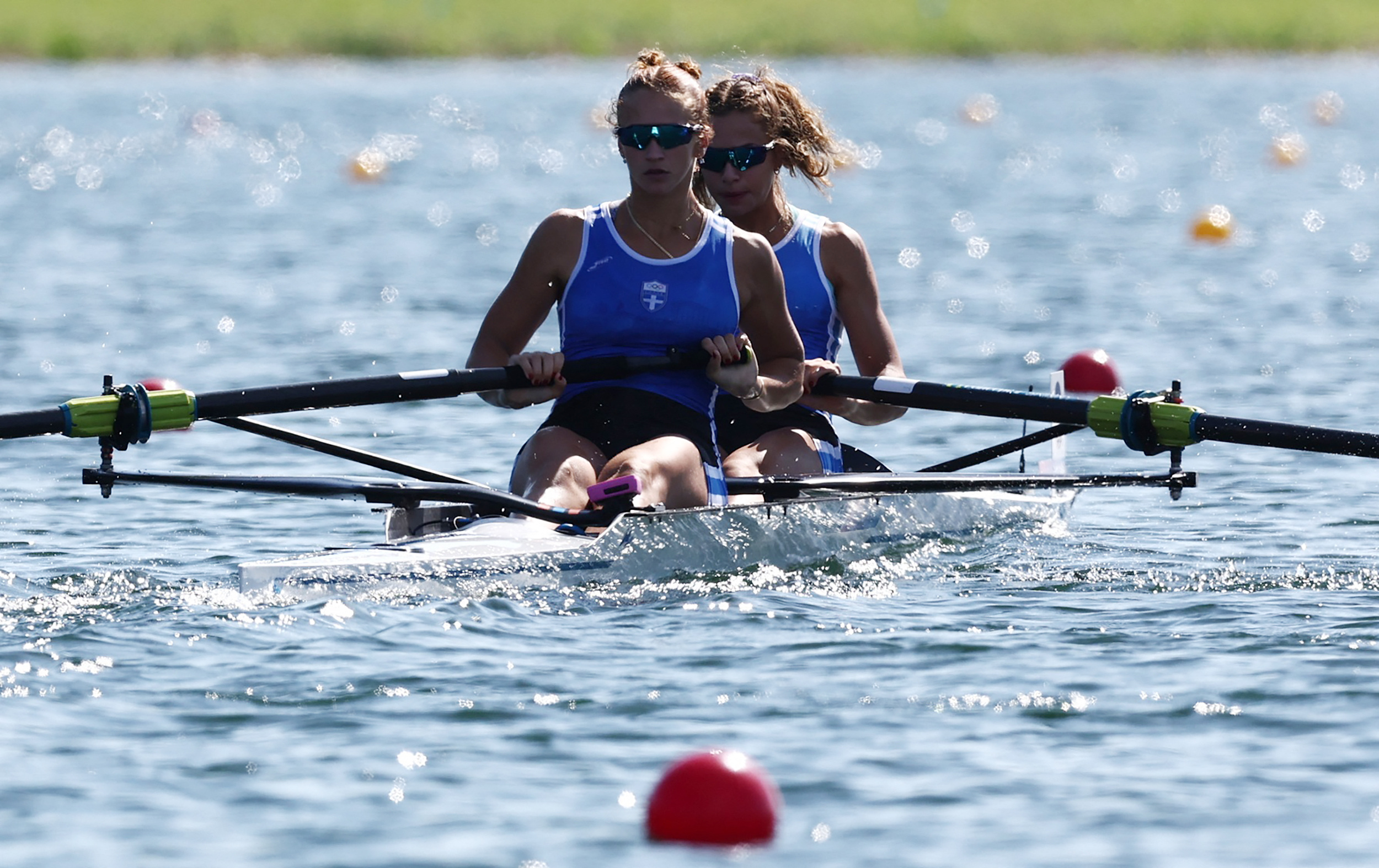 Paris 2024 Olympics - Rowing - Women's Pair Heats - Vaires-sur-Marne Nautical Stadium - Flatwater, Vaires-sur-Marne, France - July 28, 2024. Evangelia Anastasiadou of Greece and Christina Bourmpou of Greece in action. REUTERS