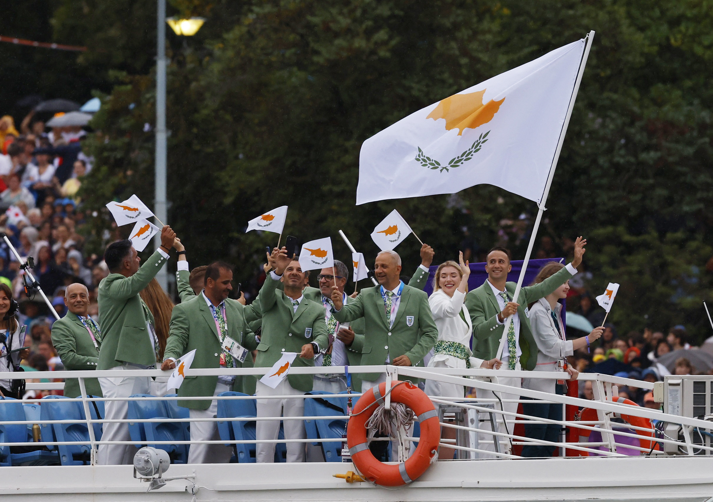 Paris 2024 Olympics - Opening Ceremony - Paris, France - July 26, 2024. Team Cyprus aboard a boat in the floating parade on the river Seine during the opening ceremony REUTERS