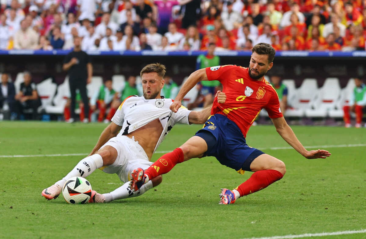 Soccer Football - Euro 2024 - Quarter Final - Spain v Germany - Stuttgart Arena, Stuttgart, Germany - July 5, 2024 Germany's Niclas Fullkrug in action with Spain's Nacho REUTERS