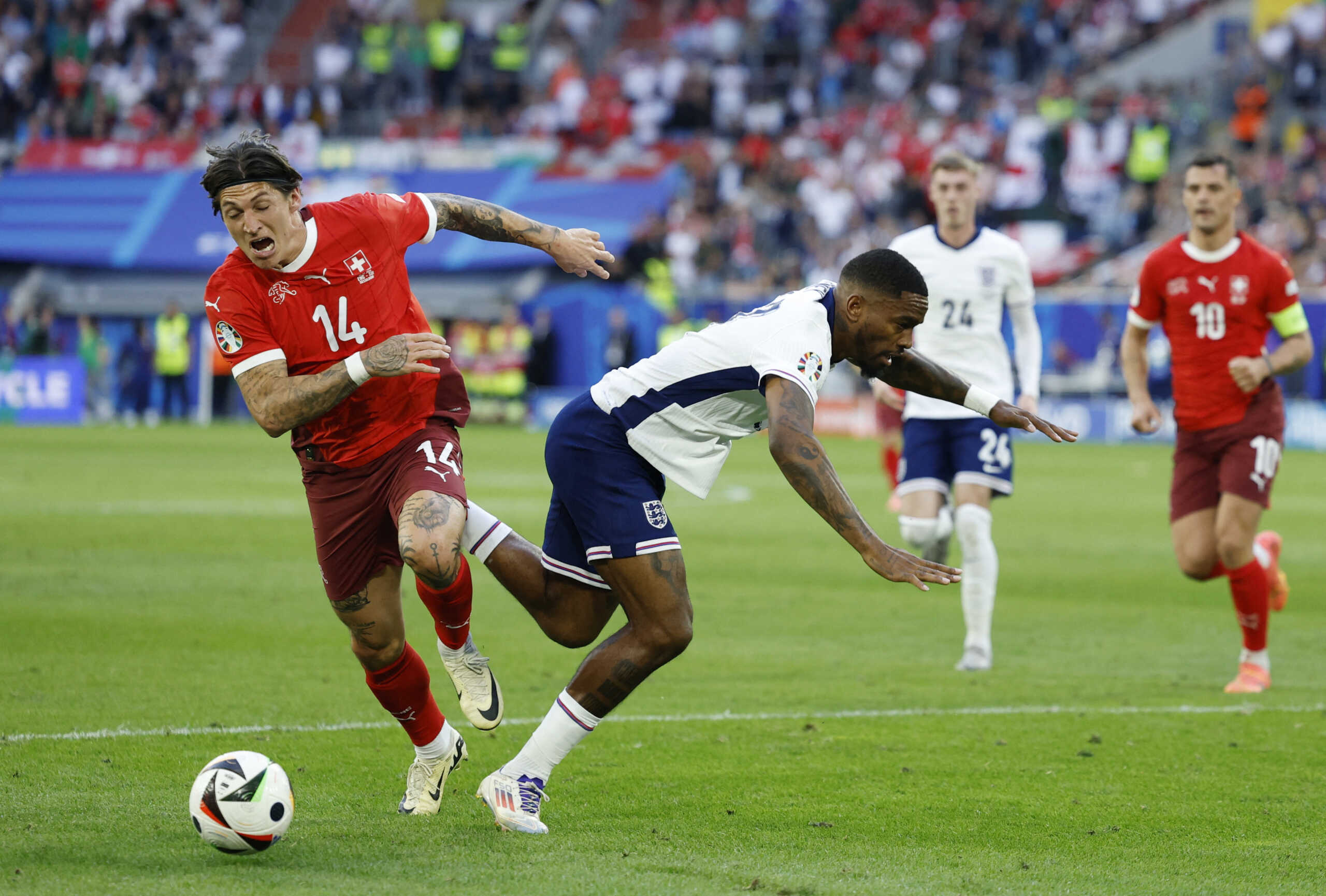 Soccer Football - Euro 2024 - Quarter Final - England v Switzerland - Dusseldorf Arena, Dusseldorf, Germany - July 6, 2024 England's Ivan Toney in action with Switzerland's Steven Zuber REUTERS