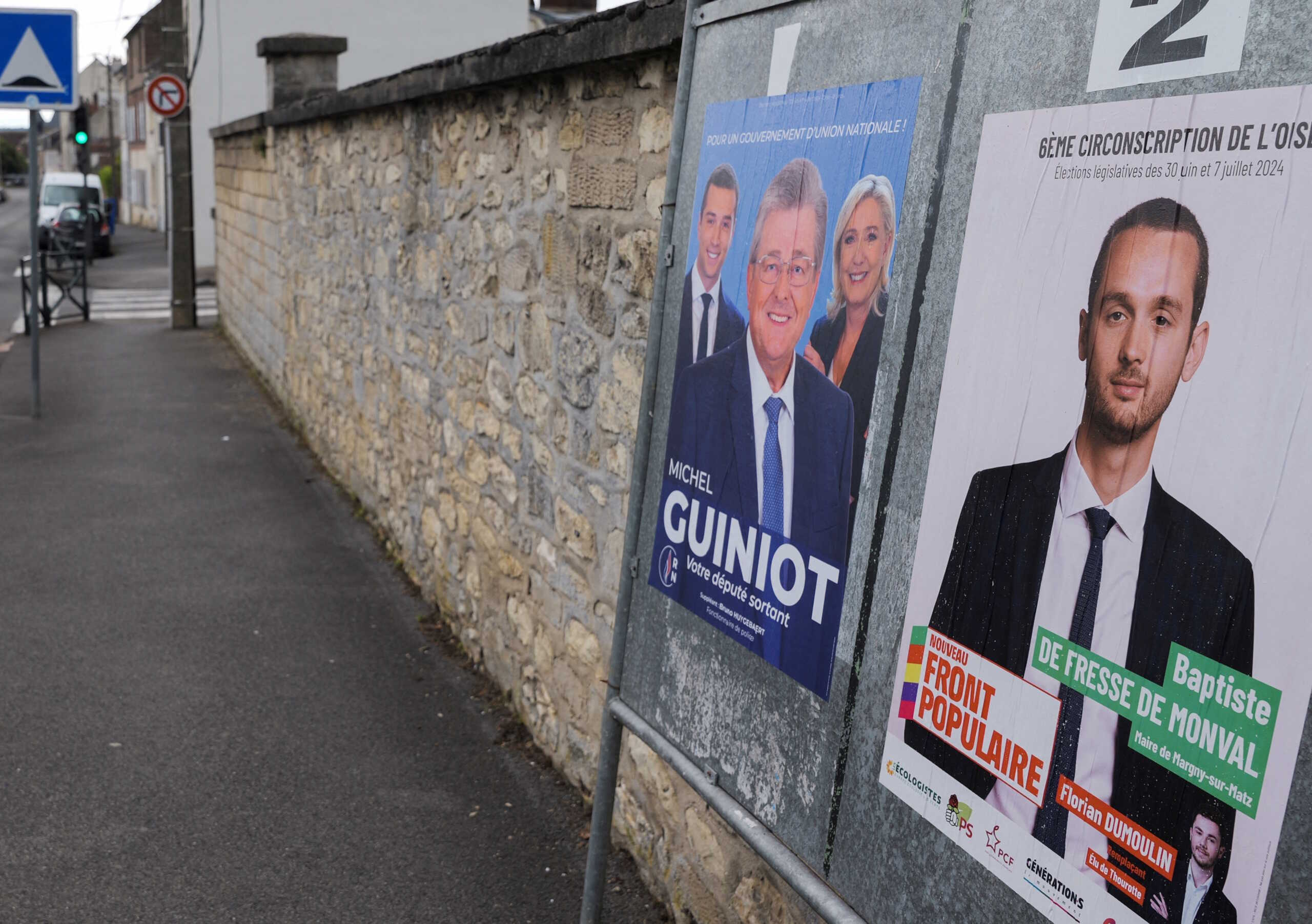Campaign posters are seen on election boards prior to the second round of the early French parliamentary elections, in Crepy-en-Valois, near Paris, France, July 1, 2024.   REUTERS