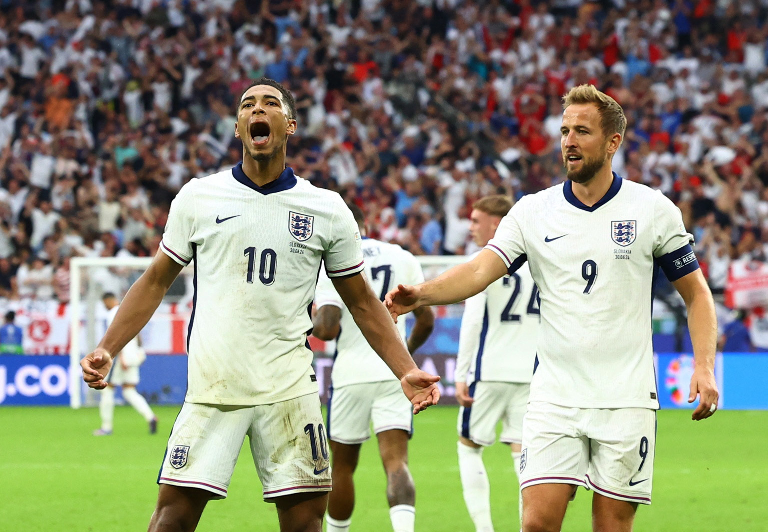 Soccer Football - Euro 2024 - Round of 16 - England v Slovakia - Arena AufSchalke, Gelsenkirchen, Germany - June 30, 2024 England's Jude Bellingham celebrates scoring their first goal with Harry Kane REUTERS