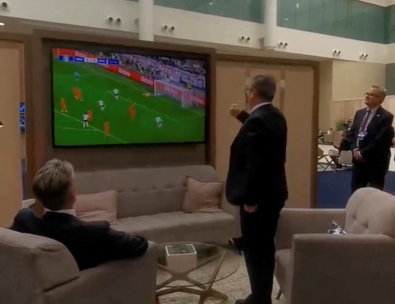 British Prime Minister Keir Starmer celebrates England's equaliser as he and Dutch Prime Minister Dick Schoof watch the Euro semi-finals between England and the Netherlands on the sidelines of the NATO summit in Washington, U.S., July 10, 2024 in this still image obtained from social media video.  @Keir_Starmer via X