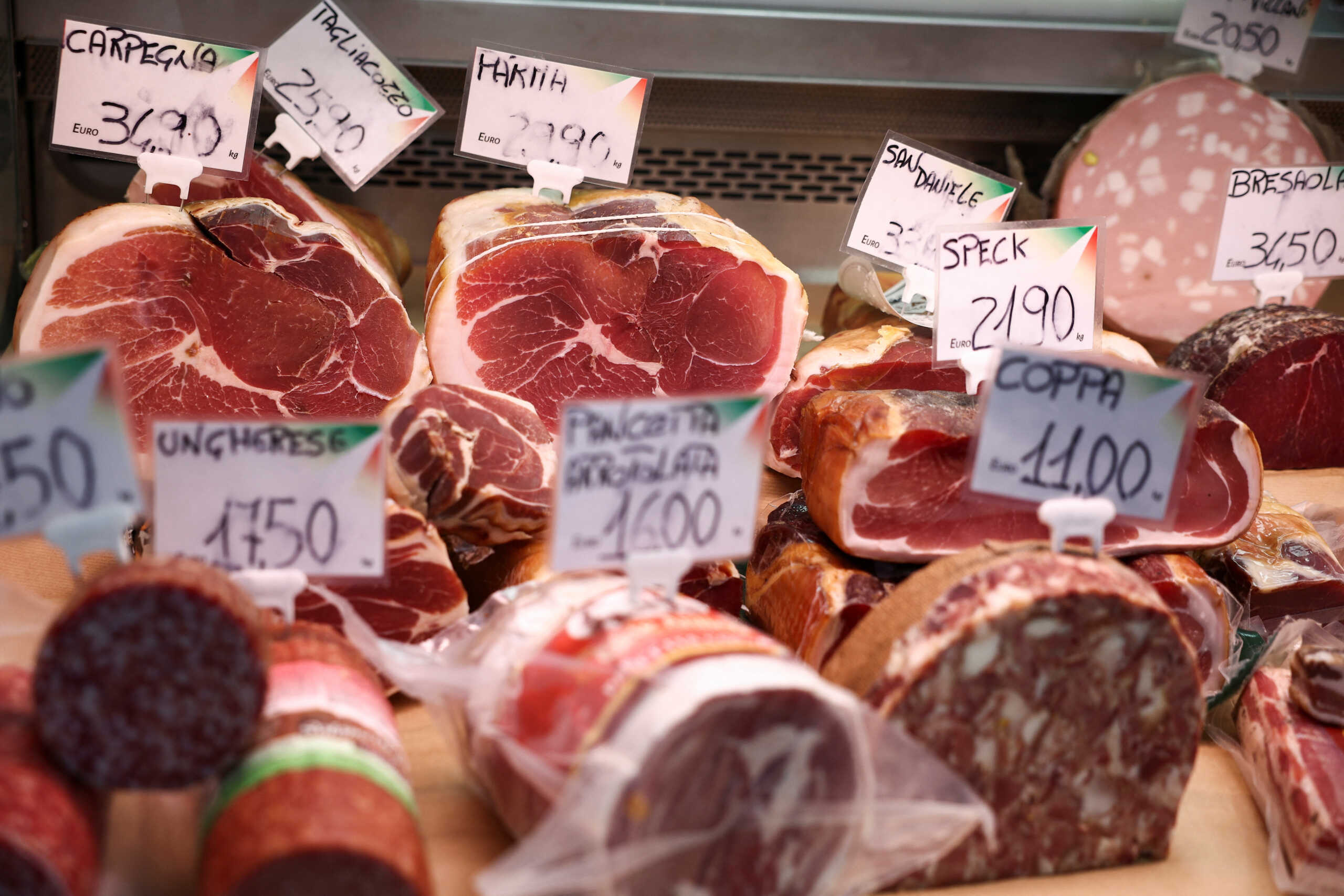 Cured meat products made with pork are displayed at a market stall in Rome, Italy, June 17, 2024. REUTERS