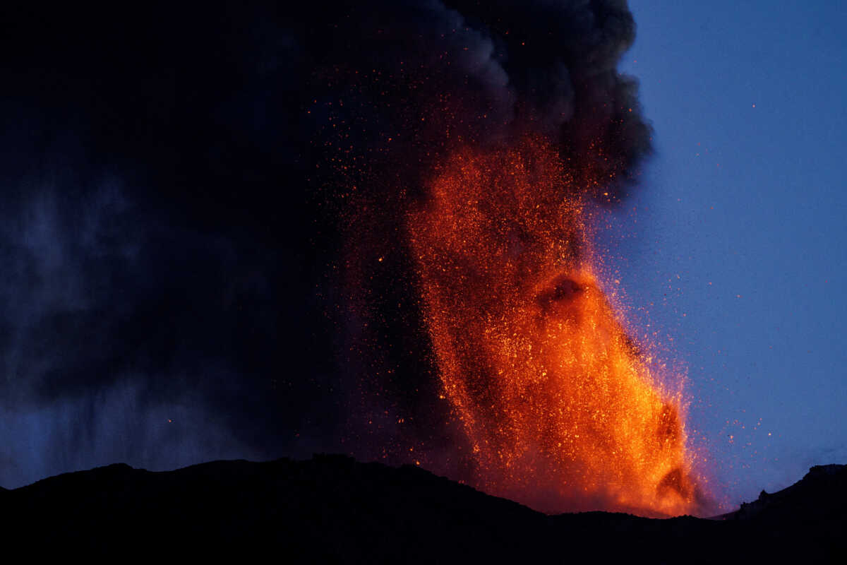 Lava and smoke rise from a crater of Mount Etna, Europe's most active volcano, Italy July 4, 2024. REUTERS