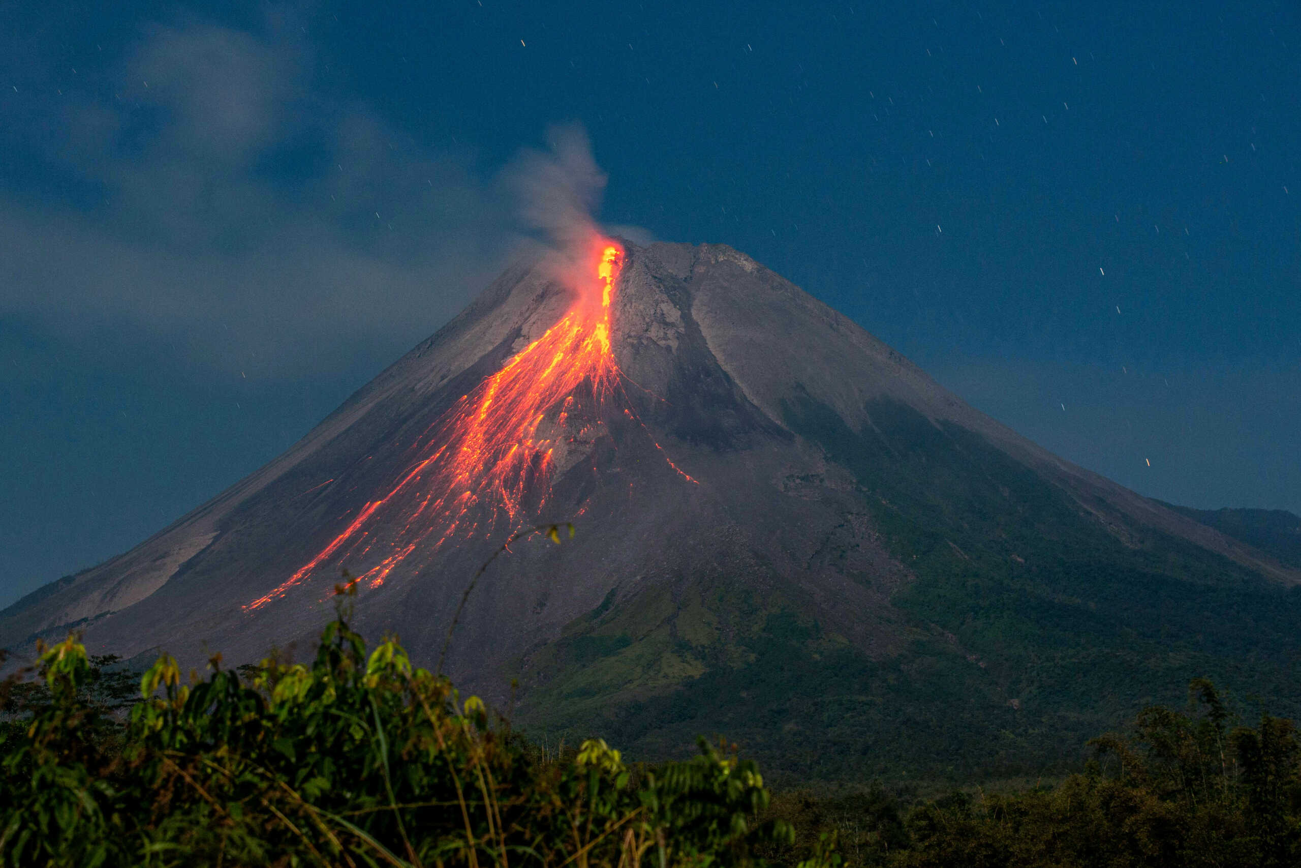 Mount Merapi volcano spews hot lava as seen from Turi, Sleman in Yogyakarta, Indonesia, July 21, 2024, in this photo taken by Antara Foto. Antara Foto