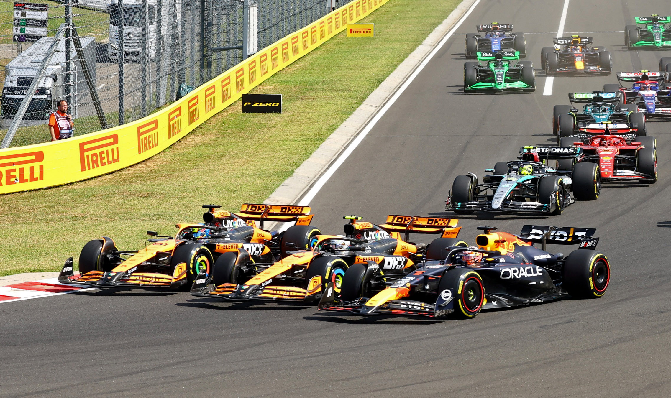 Formula One F1 - Hungarian Grand Prix - Hungaroring, Budapest, Hungary - July 21, 2024 McLaren's Oscar Piastri leads into the first corner at the start of the race ahead of McLaren's Lando Norris and Red Bull's Max Verstappen REUTERS
