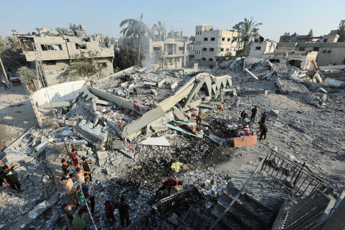 Palestinians inspect a destroyed mosque, following an Israeli strike, amid Israel-Hamas conflict, in Deir Al-Balah, in the central Gaza Strip, July 27, 2024. REUTERS