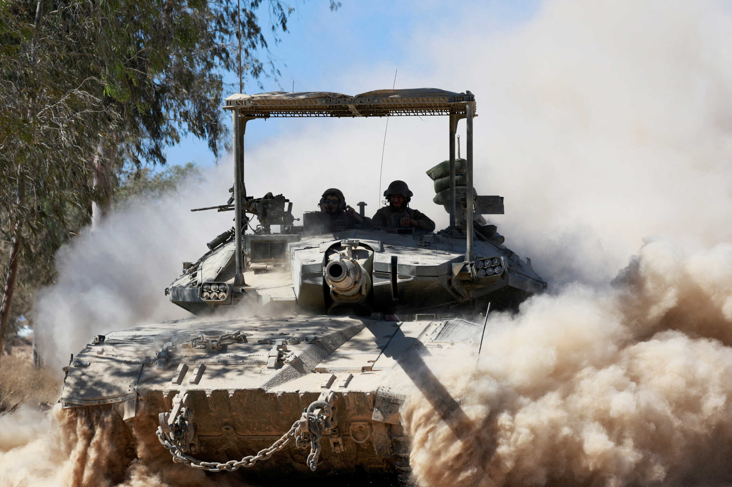 FILE PHOTO: An Israeli tank manoeuvres near the Israel-Gaza border, amid the Israel-Hamas conflict, in Israel, July 2, 2024. REUTERS