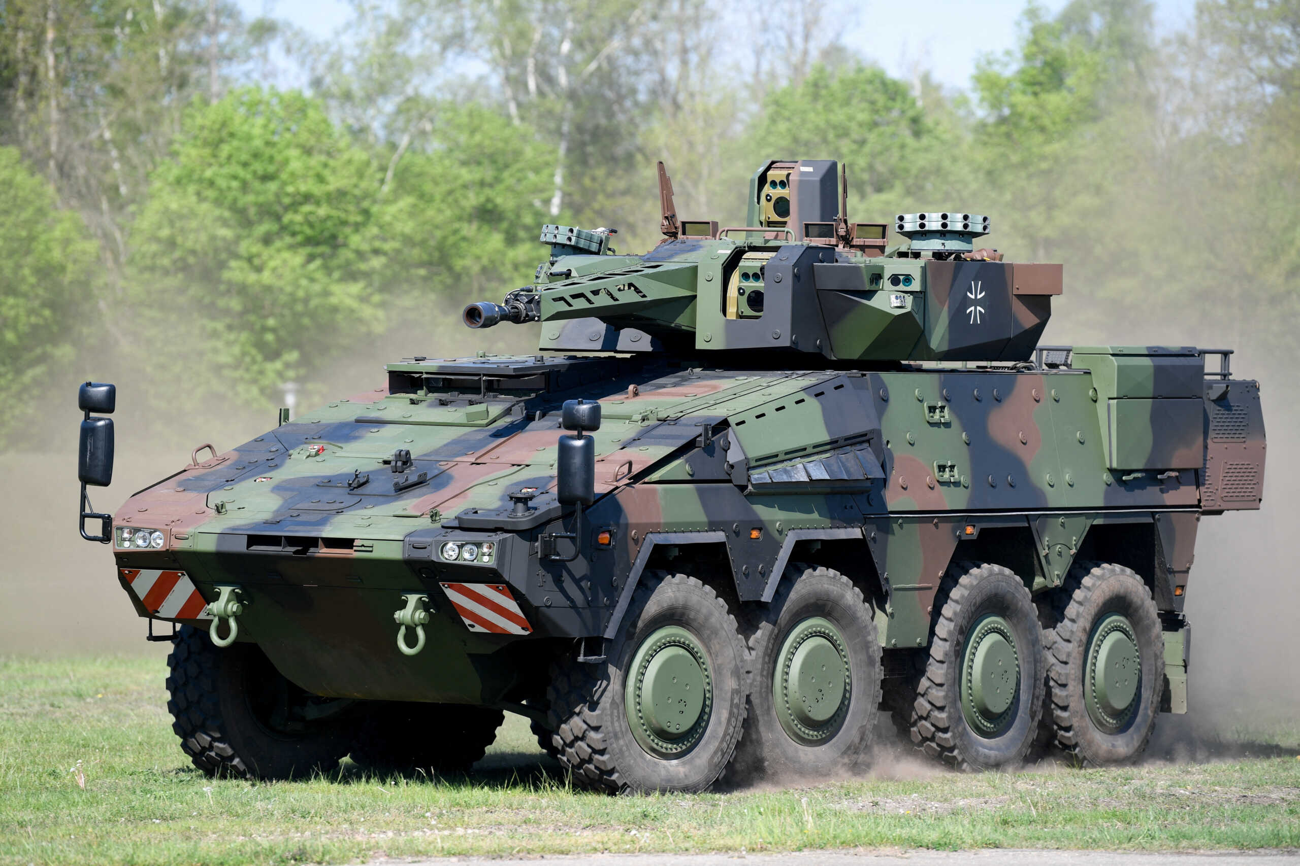 FILE PHOTO: A Boxer armoured transport vehicle manoeuvres on the day arms manufacturer Rheinmetall hands the first one over to the German armed forces Bundeswehr, in Unterluess, Germany, May 2, 2024. REUTERS