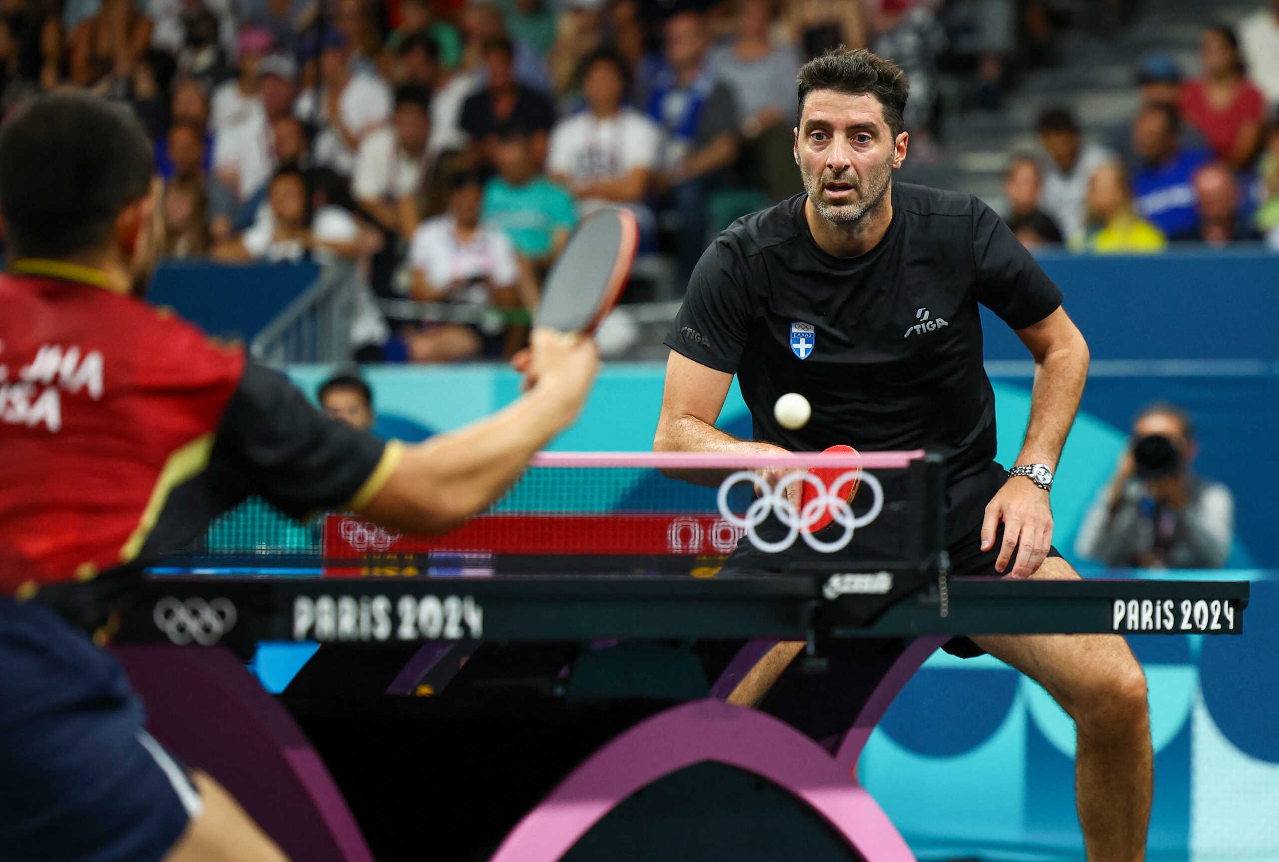 Paris 2024 Olympics - Table Tennis - Men's Singles Round of 32 - South Paris Arena 4, Paris, France - July 31, 2024. Panagiotis Gionis of Greece in action during his round of 32 match against Kanak Jha of United States. REUTERS