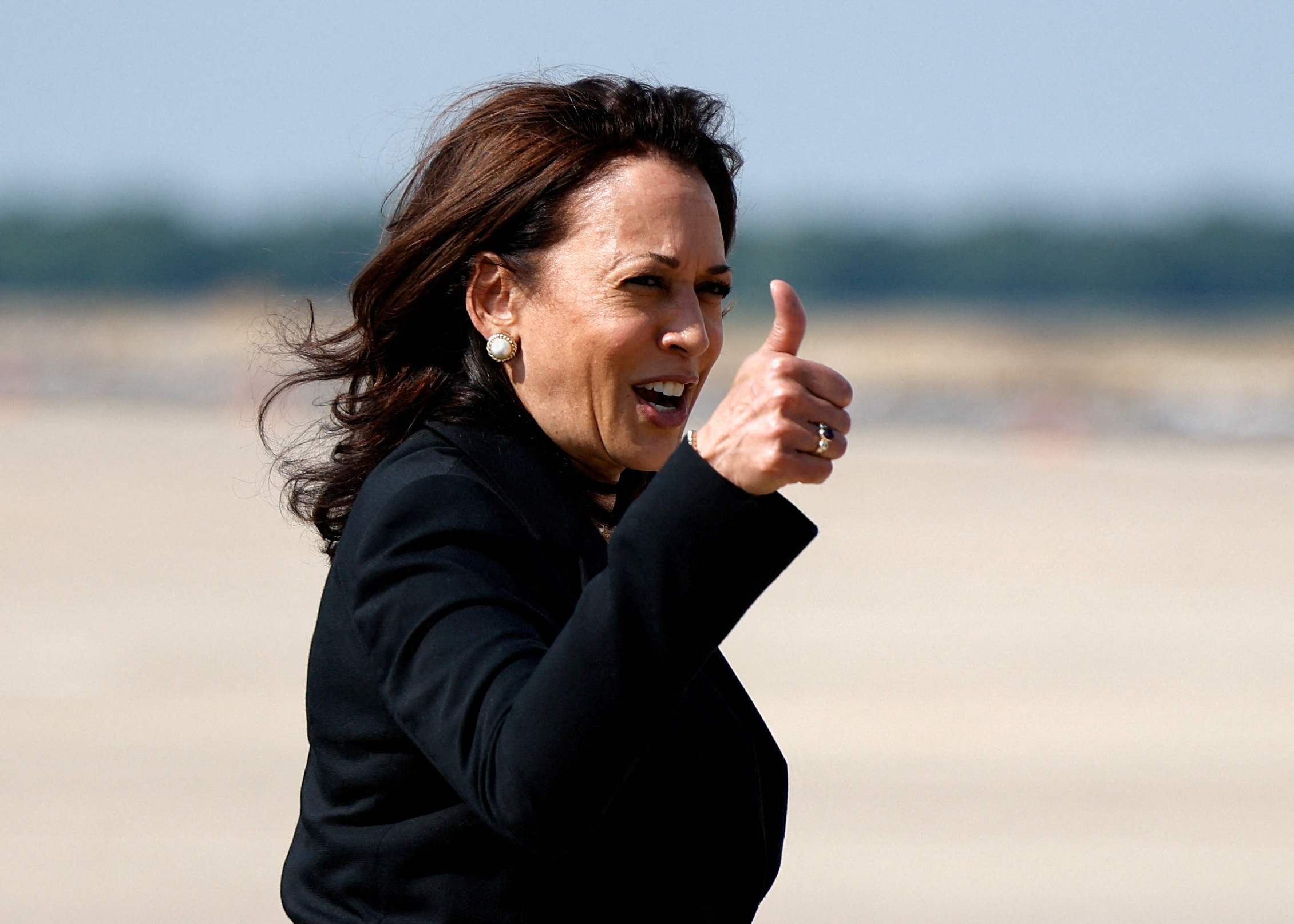 FILE PHOTO: U.S. Vice President Kamala Harris gestures as she boards Air Force Two, after changing planes due to technical difficulties, for her first international trip as Vice President to Guatemala and Mexico, at Joint Base Andrews, Maryland, U.S., June 6, 2021. REUTERS