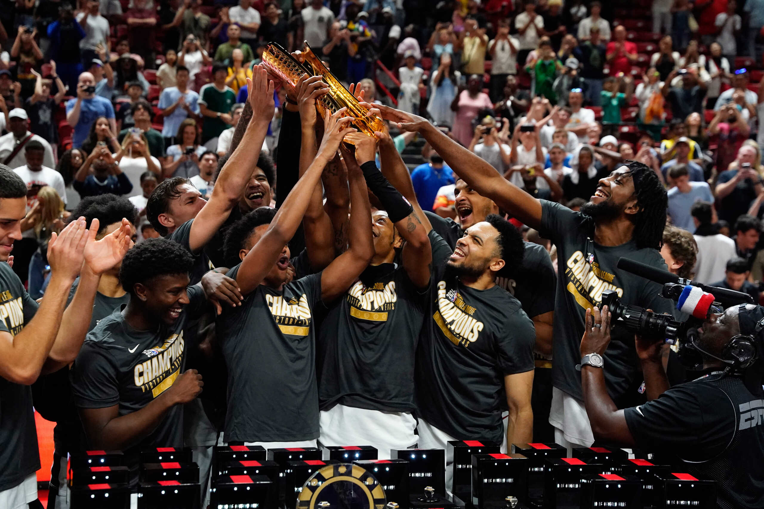 Jul 22, 2024; Las Vegas, NV, USA; Miami Heat lift the 2025 Summer League Champions trophy after defeating the Memphis Grizzlies in overtime at Thomas & Mack Center. Mandatory Credit: Lucas Peltier-USA TODAY Sports