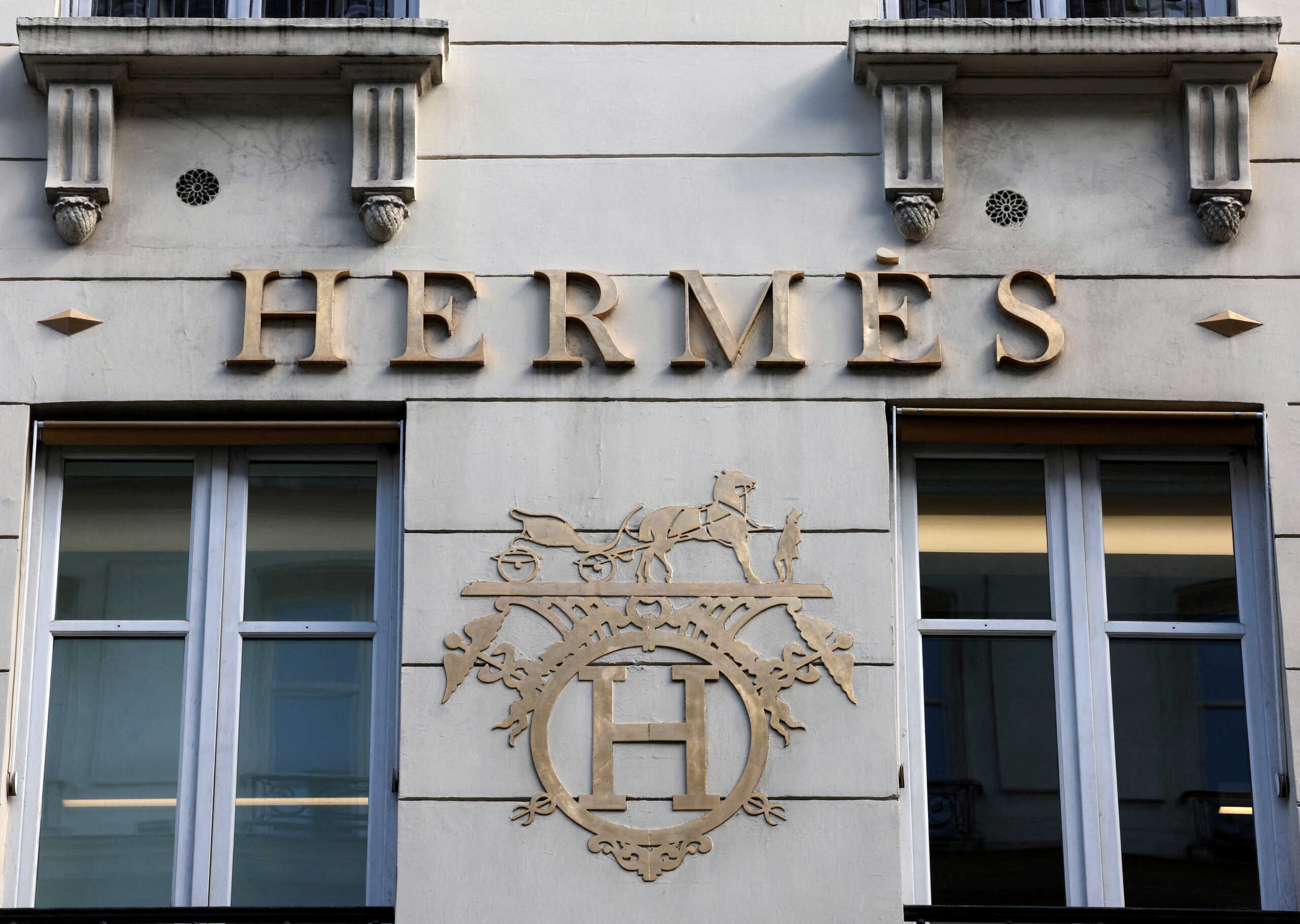 FILE PHOTO: A logo of fashion house Hermes is seen outside a shop in Paris, France, April 15, 2024. REUTERS
