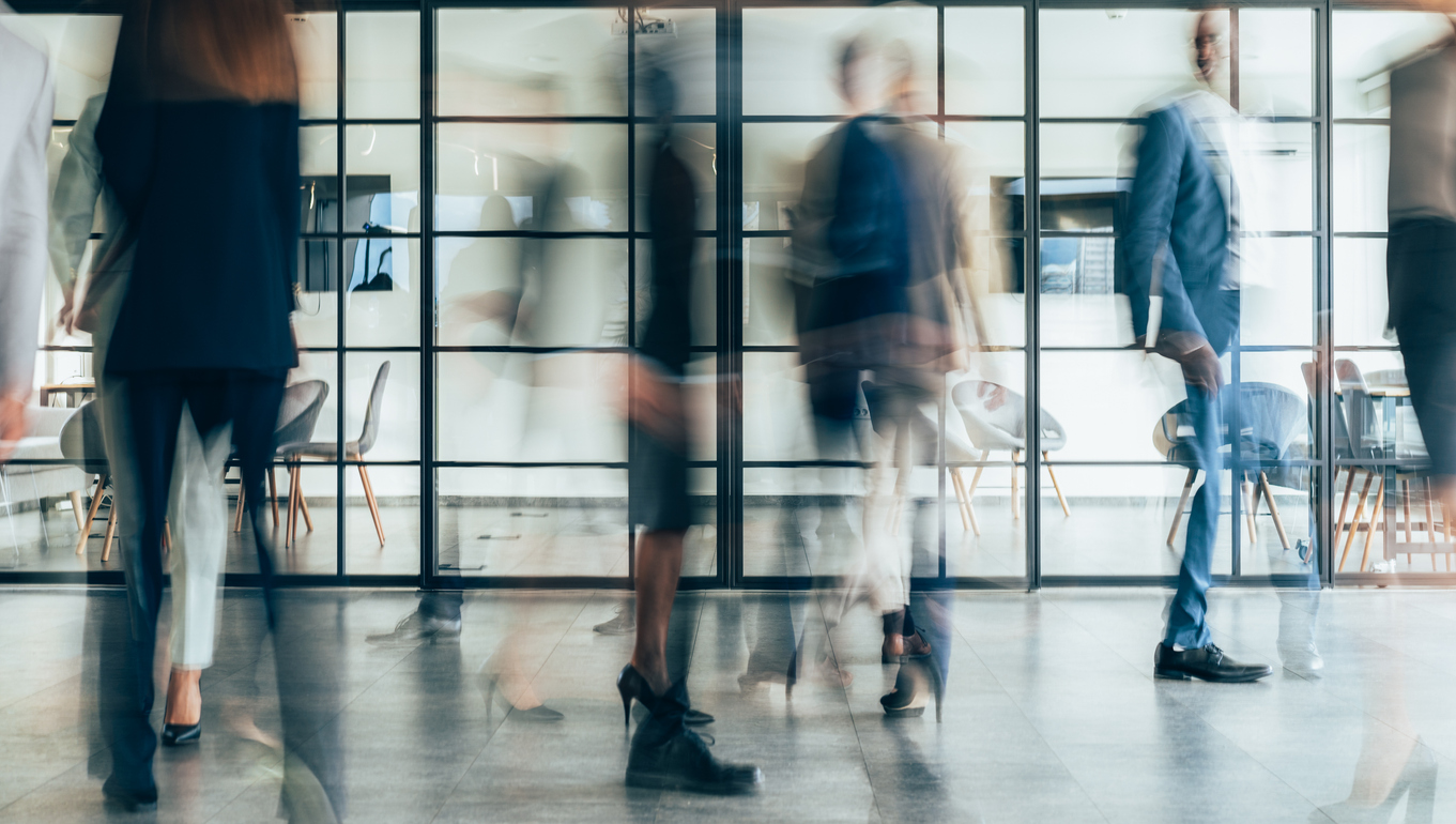 Busy modern workplace. Working process in the office, business people working, walking and talking, blurred motion