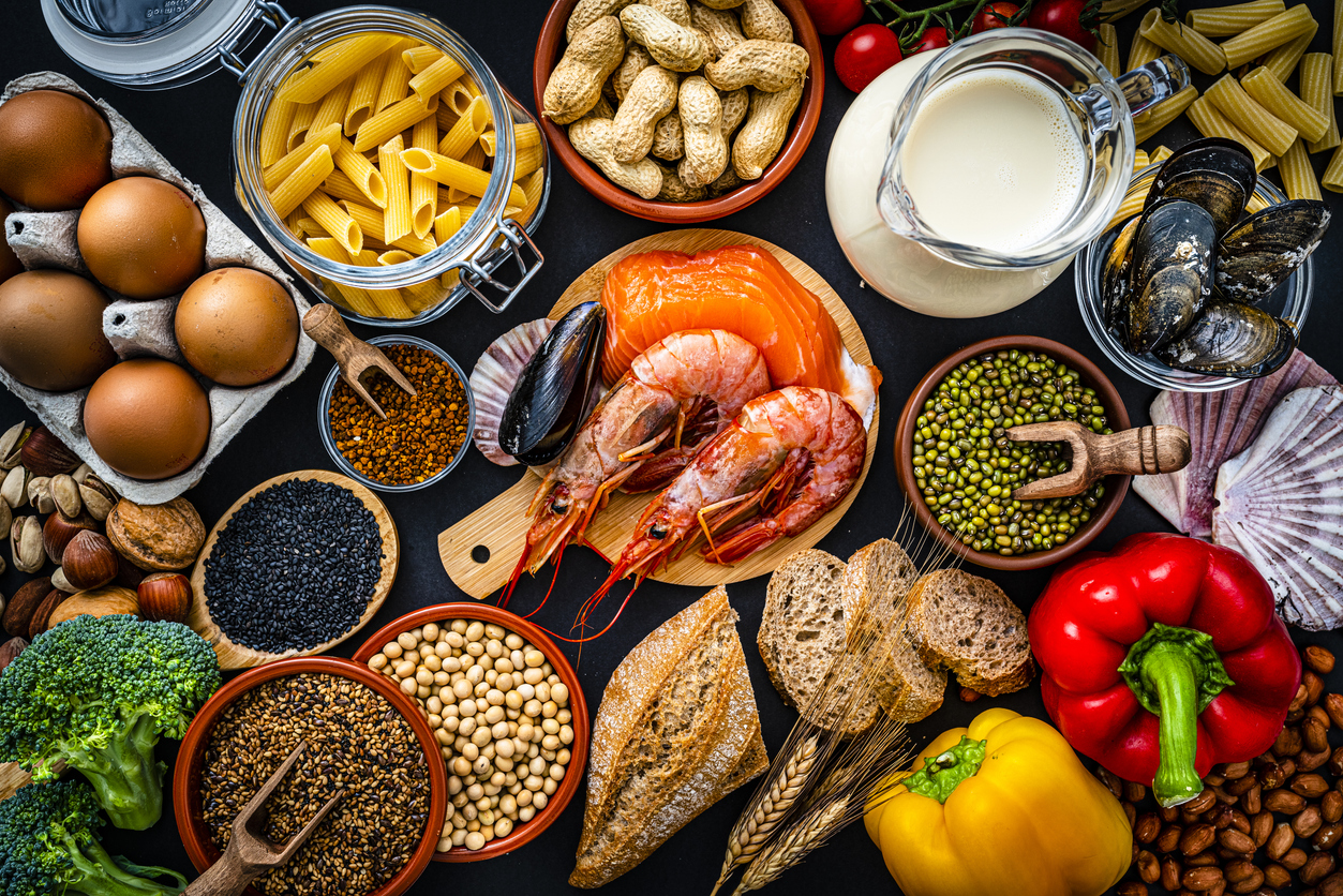 Most common allergens food shot from above. The composition includes fish, crustaceans mussels, peanut, eggs, milk soy products, bee pollen, nuts, wheat and derivates and sesame. High resolution 42Mp studio digital capture taken with SONY A7rII and Zeiss Batis 40mm F2.0 CF lens