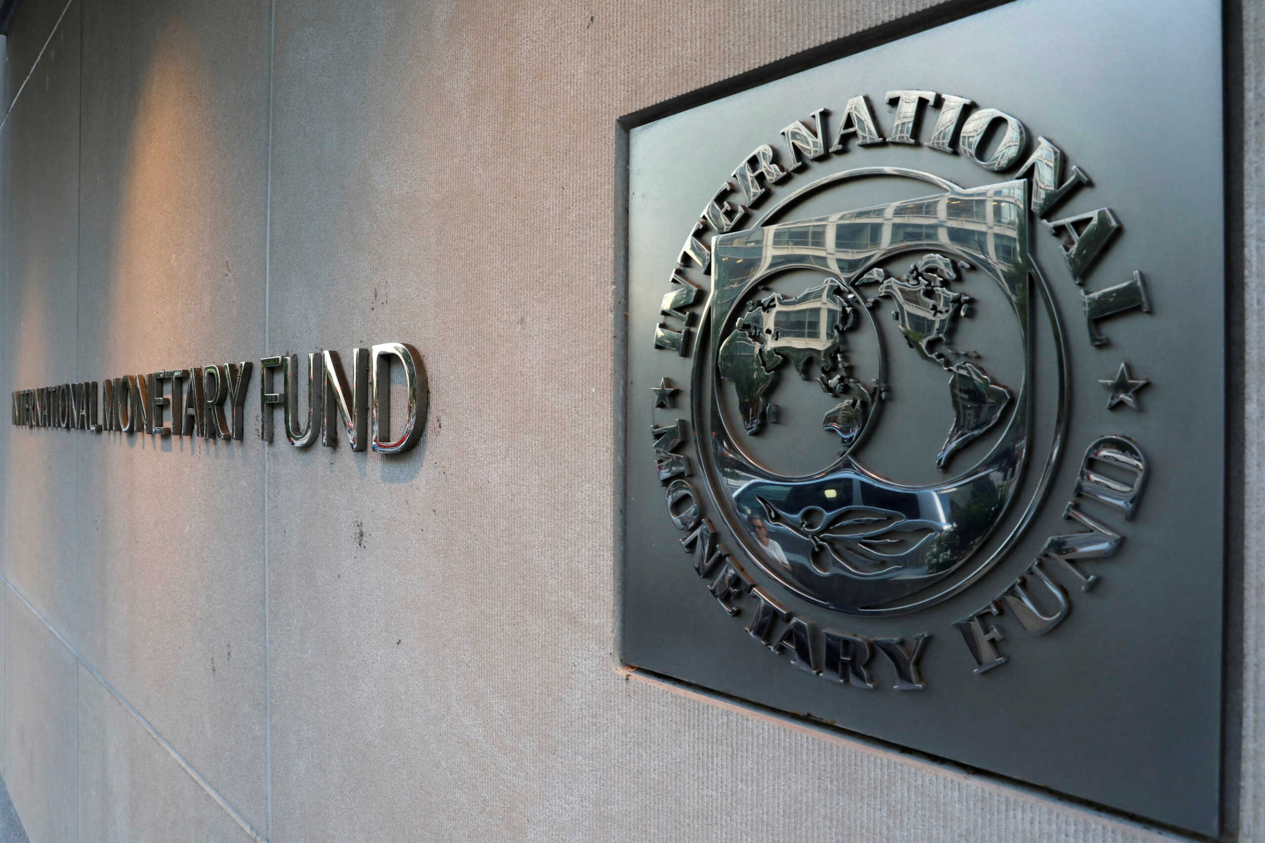 FILE PHOTO: The International Monetary Fund (IMF) logo is seen outside the headquarters building in Washington, U.S. on September 4, 2018. REUTERS