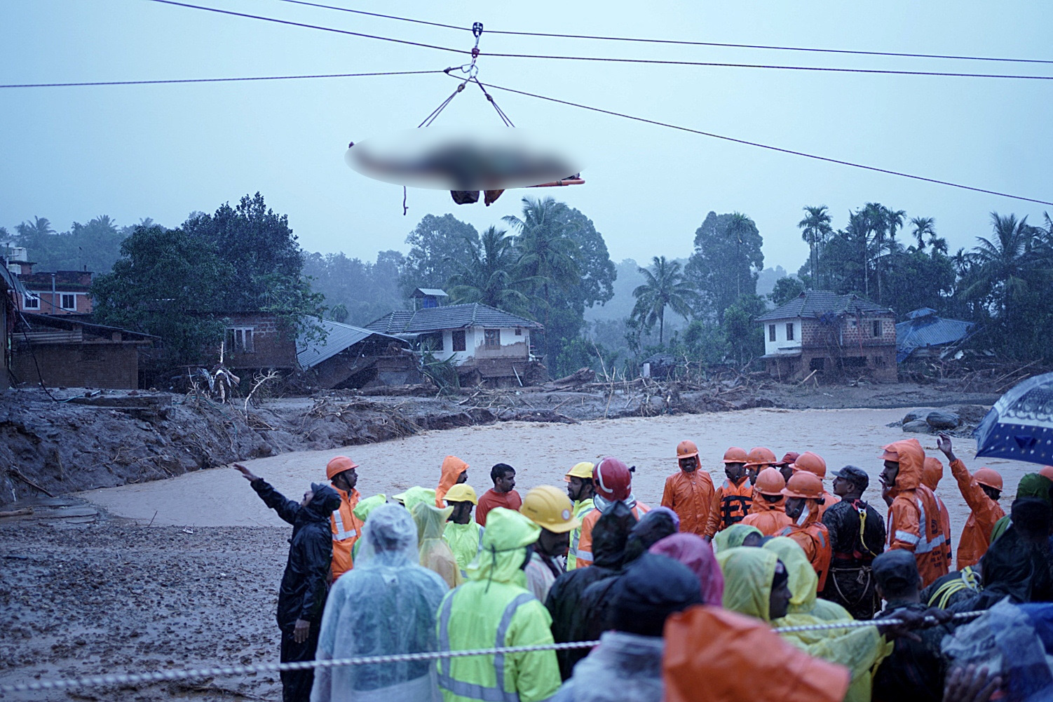 SENSITIVE MATERIAL. THIS IMAGE MAY OFFEND OR DISTURB  The body of a victim is moved from a landslide site after multiple landslides in the hills, in Chooralmala in Wayanad district, in the southern state of Kerala, India, July 30, 2024. REUTERS