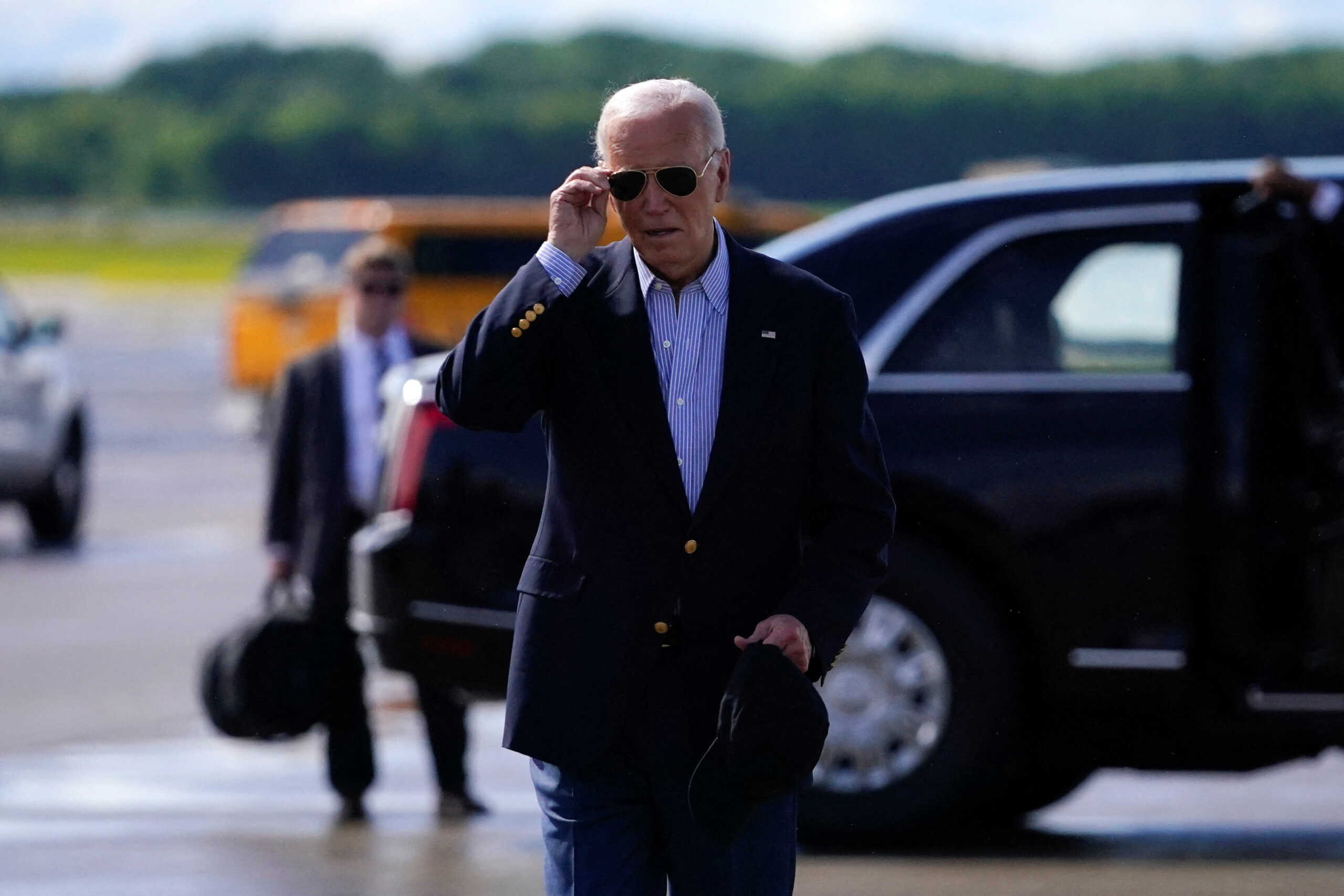 U.S. President Joe Biden walks at Dane County Regional Airport, in Madison, Wisconsin, U.S., July 5, 2024. REUTERS