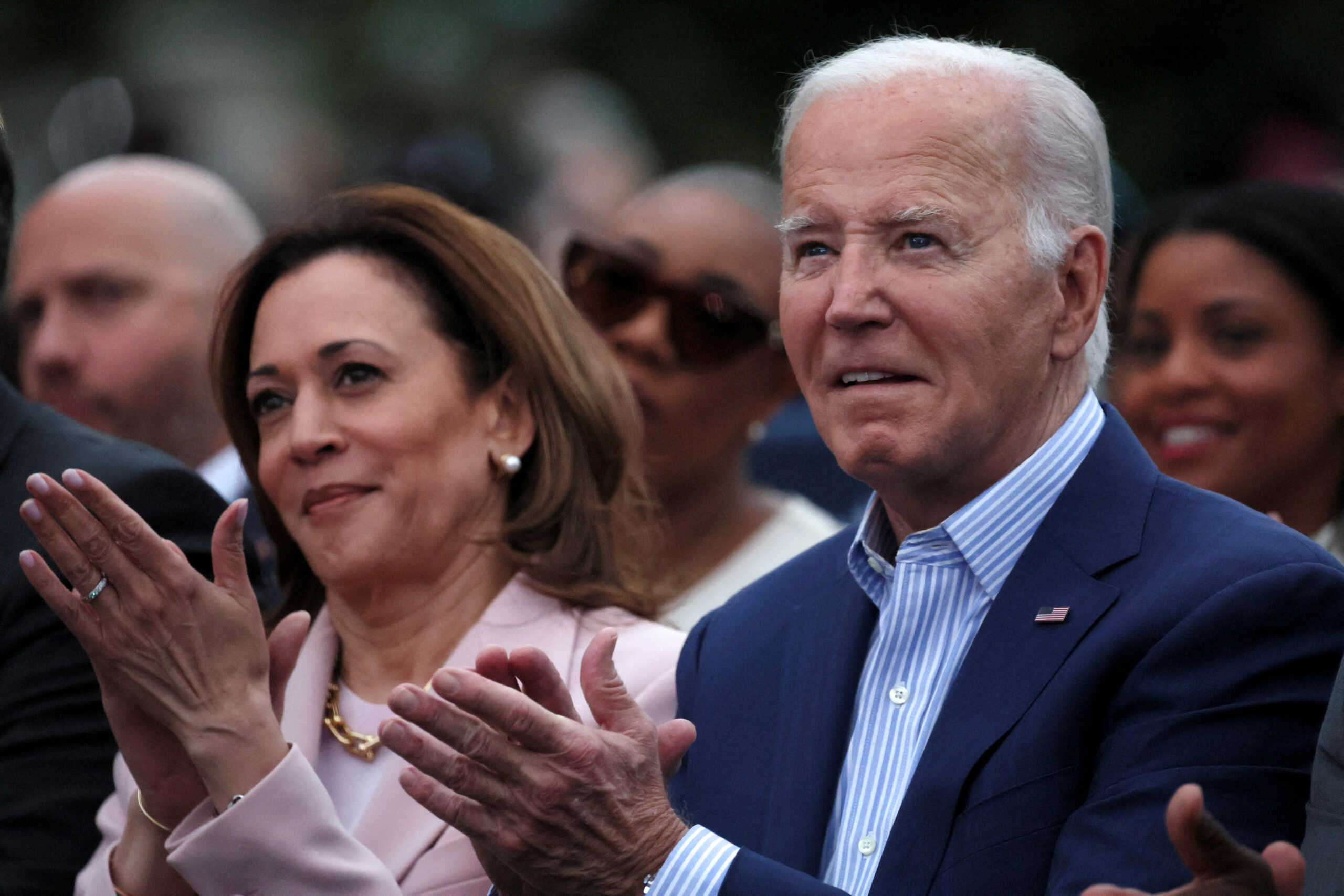 FILE PHOTO: U.S. President Joe Biden claps hands next to U.S. Vice-President Kamala Harris while hosting a Juneteenth concert on the South Lawn at the White House in Washington, D.C., U.S. June 10, 2024. REUTERS