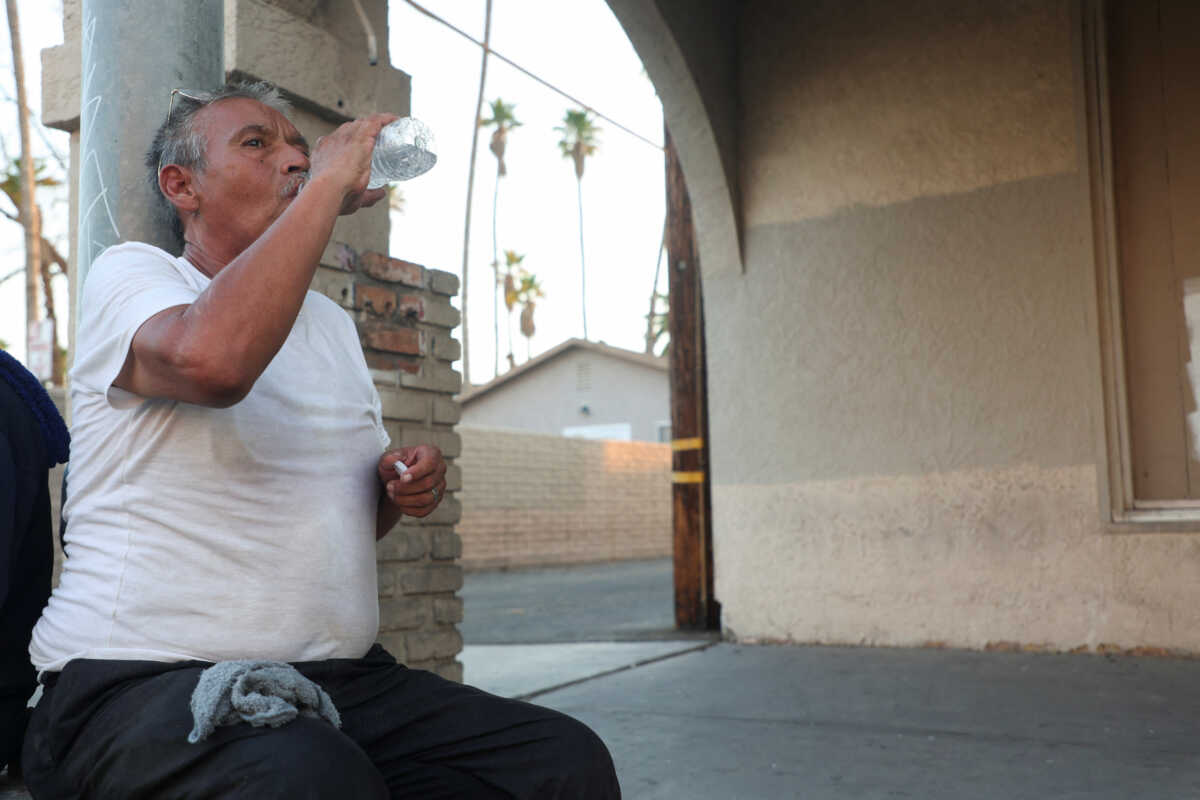 Fernando Toledo drinks water at a free dinner during a period of excessive heat in Calexico, California, U.S. July 7, 2024.  REUTERS