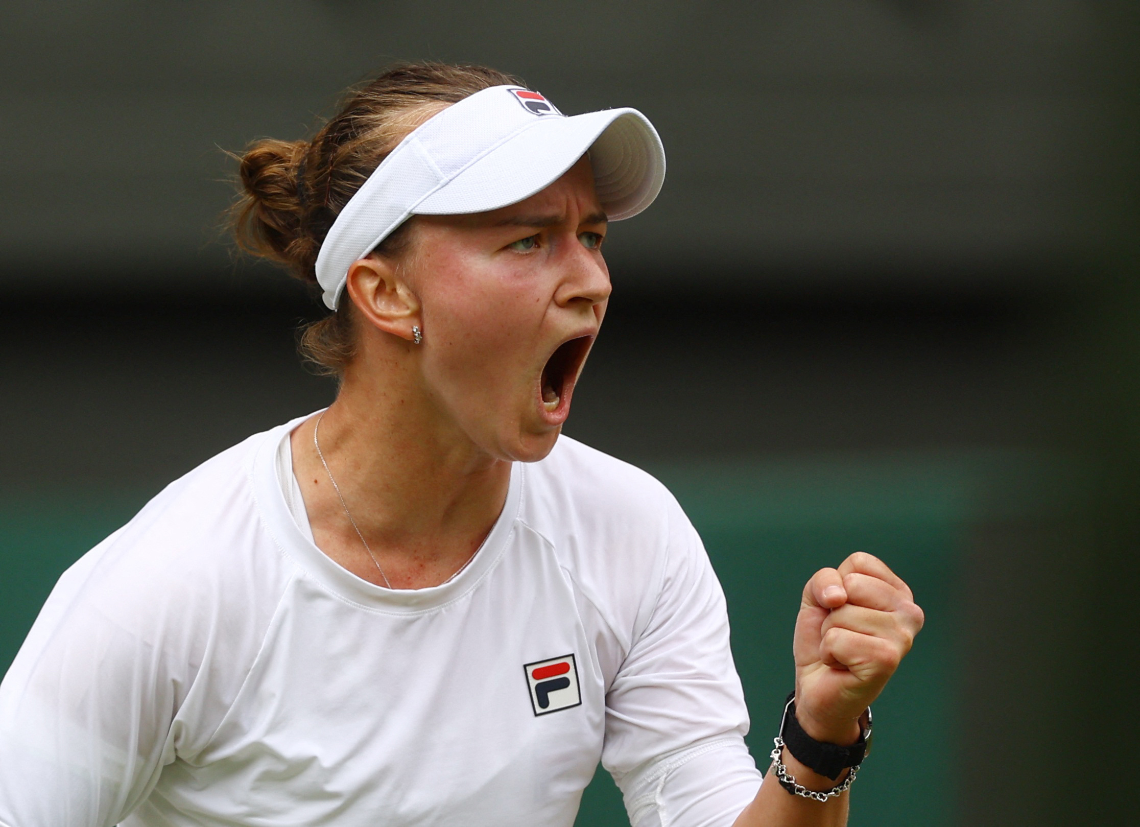 Tennis - Wimbledon - All England Lawn Tennis and Croquet Club, London, Britain - July 13, 2024 Czech Republic's Barbora Krejcikova celebrates winning the first set during her final against Italy's Jasmine Paolini REUTERS