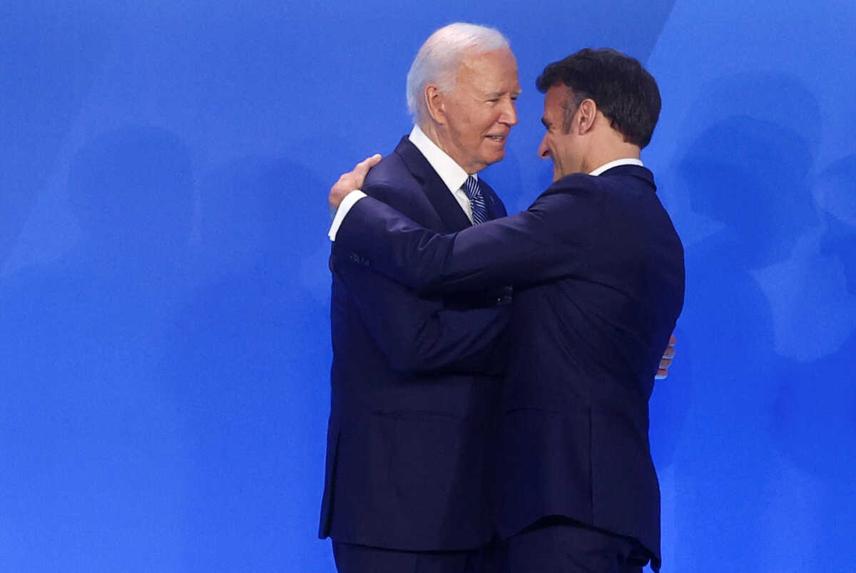 French President Emmanuel Macron is greeted by U.S. President Joe Biden, during NATO's 75th anniversary summit in Washington, U.S., July 10, 2024. REUTERS