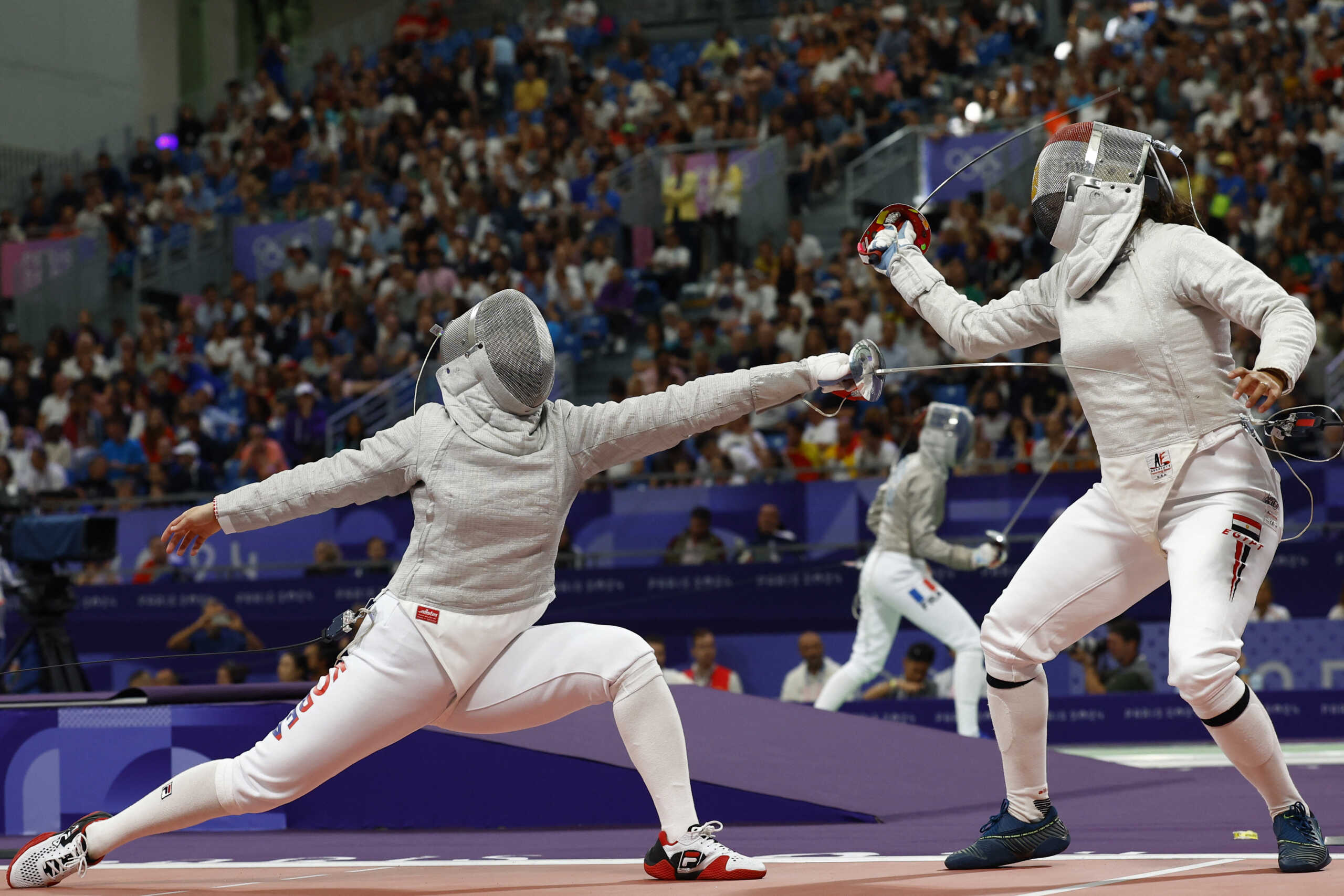 Paris 2024 Olympics - Fencing - Women's Sabre Individual Table of 16 - Grand Palais, Paris, France - July 29, 2024. Hayoung Jeon of South Korea in action against Nada Hafez of Egypt. REUTERS