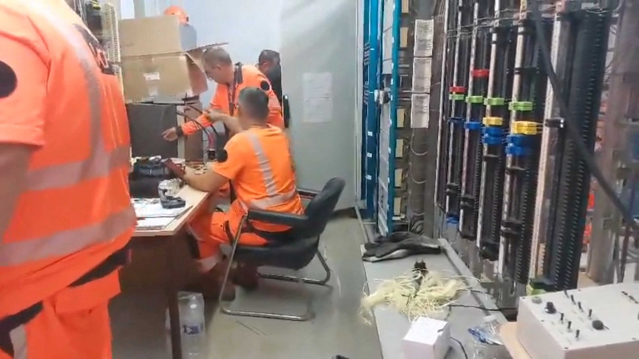 FILE PHOTO: SNCF employees work to repair damages, following a series of coordinated actions by vandals, that brought major disruption to high-speed train network, ahead of the Paris 2024 Olympics opening ceremony, in Courtalain, France, July 26, 2024 in this screengrab obtained from a social media video. @SNCFReseau via X via REUTERS    THIS IMAGE HAS BEEN SUPPLIED BY A THIRD PARTY. MANDATORY CREDIT. NO RESALES. NO ARCHIVES. BEST QUALITY AVAILABLE.