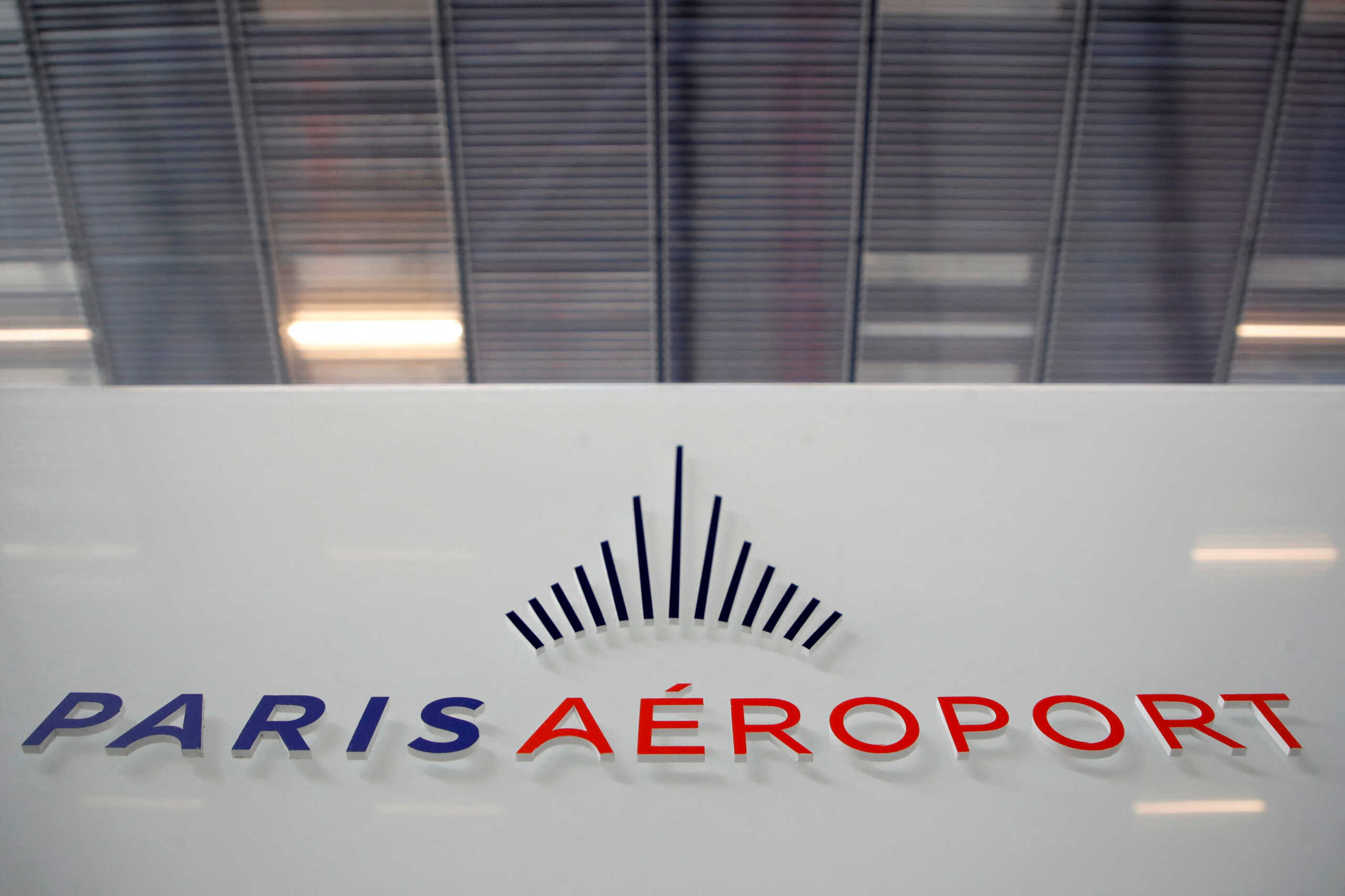 FILE PHOTO: The logo of Groupe ADP (Aeroports de Paris) is seen inside the Terminal 3 at Orly Airport, near Paris, France, July 1, 2021. REUTERS
