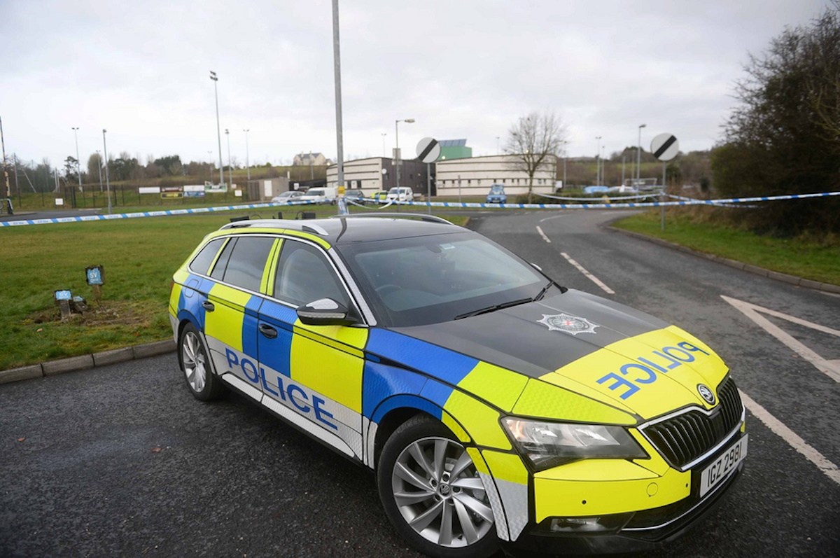 epa10485189 A police car at the cordoned off scene of a shooting at a sports complex in Omagh, County Tyrone, Northern Ireland, Britain, 23 February 2023. An off duty senior police officer named by the Police Service of Northern Ireland (PSNI) as Detective Chief Inspector John Caldwell was shot by masked men in front of young people he had been coaching at soccer in the evening of 22 February. He was hospitalized in critical but stable conditions and three men were arrested in connection with the officer’s attempted murder, the PSNI confirmed.  EPA