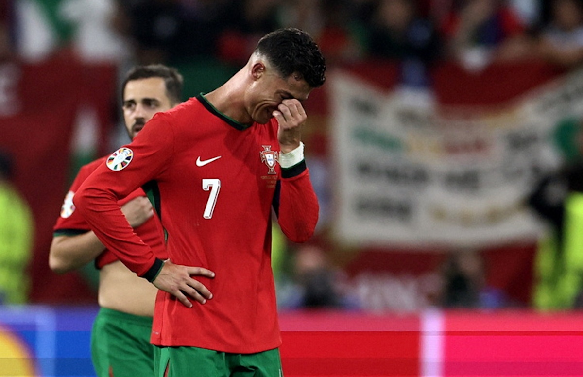 epa11451291 Cristiano Ronaldo of Portugal reacts after failing to score by penalty during the UEFA EURO 2024 Round of 16 soccer match between Portugal and Slovenia, in Frankfurt Main, Germany, 01 July 2024.  EPA