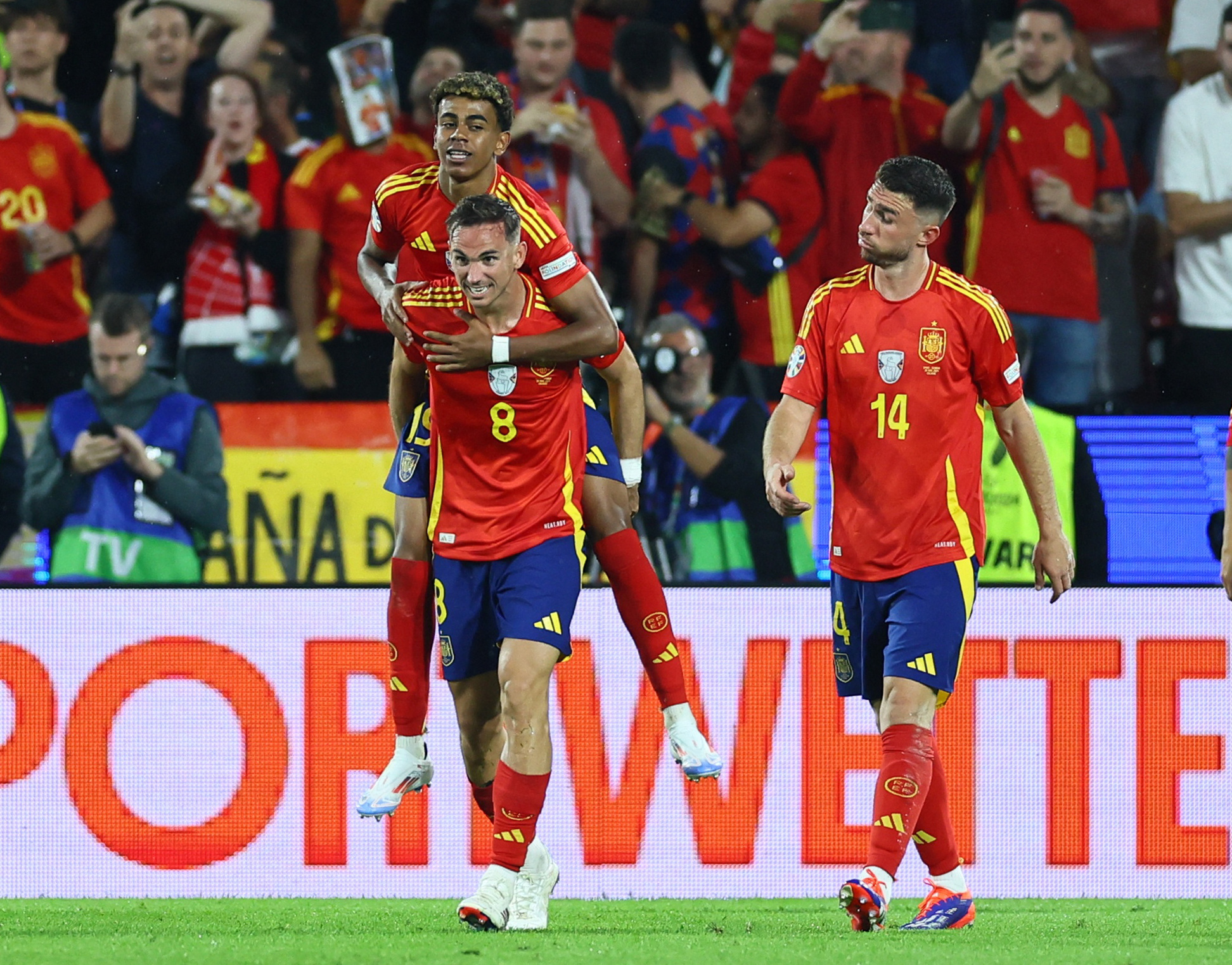 Soccer Football - Euro 2024 - Round of 16 - Spain v Georgia - Cologne Stadium, Cologne, Germany - June 30, 2024  Spain's Fabian Ruiz celebrates scoring their second goal with Aymeric Laporte and Lamine Yamal REUTERS
