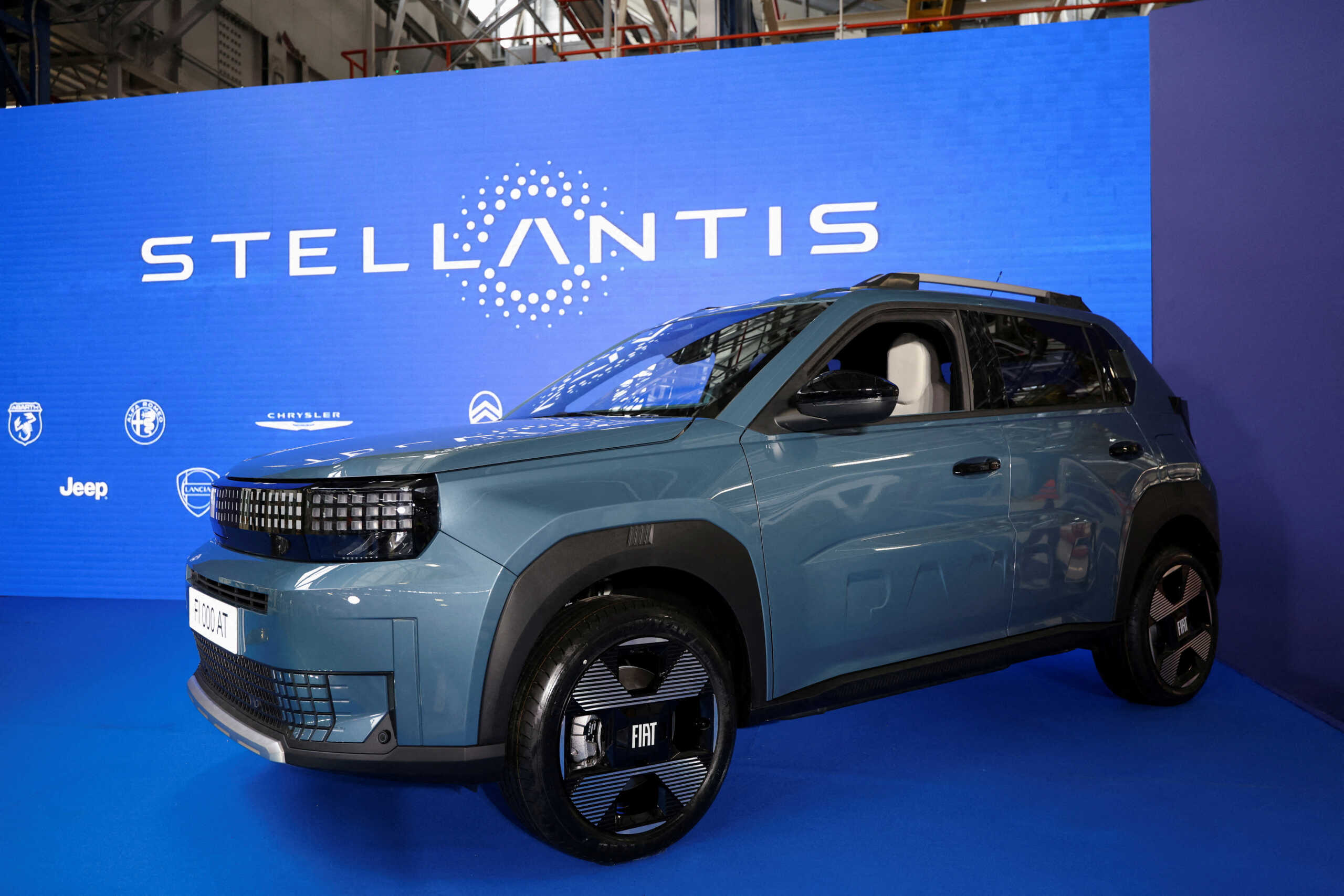 FILE PHOTO: The Stellantis logo is seen on the backdrop, with the Fiat Panda in the foreground, in Kragujevac, Serbia, July 22, 2024. REUTERS