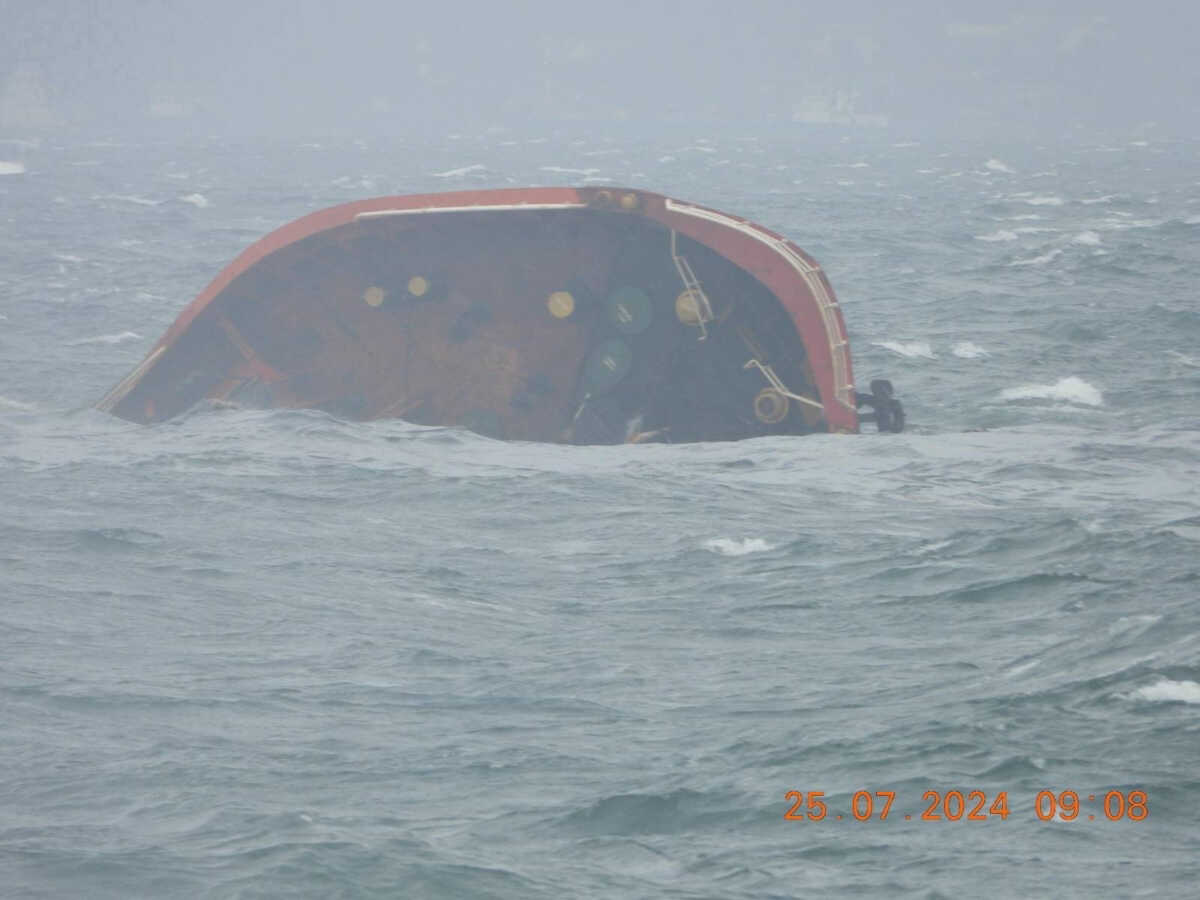 A handout photo released by the Philippine Coast Guard shows the tip of MT Terra Nova protruding in Manila Bay, Philippines, July 25, 2024. Philippine Coast Guard