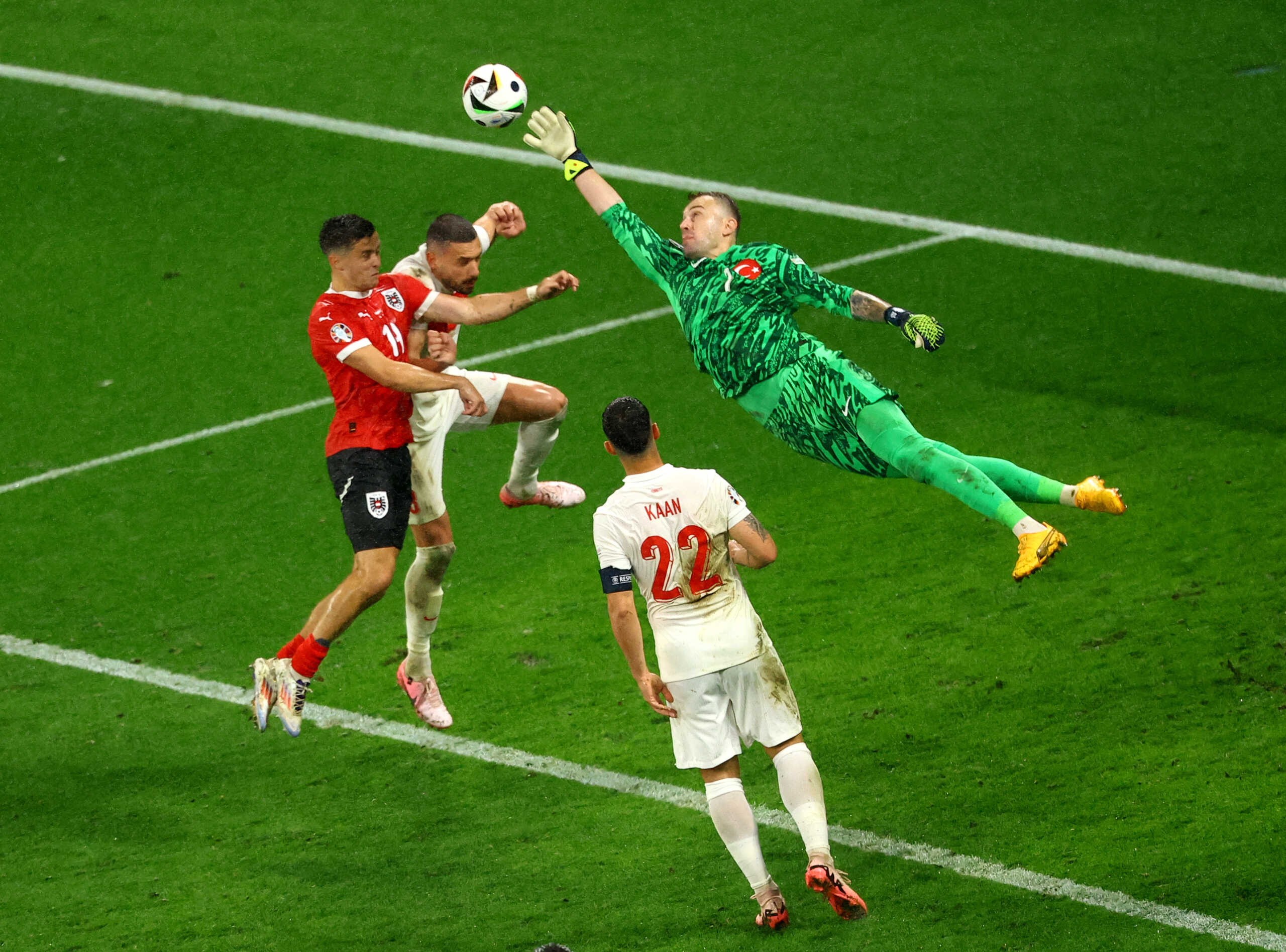 Soccer Football - Euro 2024 - Round of 16 - Austria v Turkey - Leipzig Stadium, Leipzig, Germany - July 2, 2024 Turkey's Mert Gunok makes a save from Austria's Christoph Baumgartner REUTERS