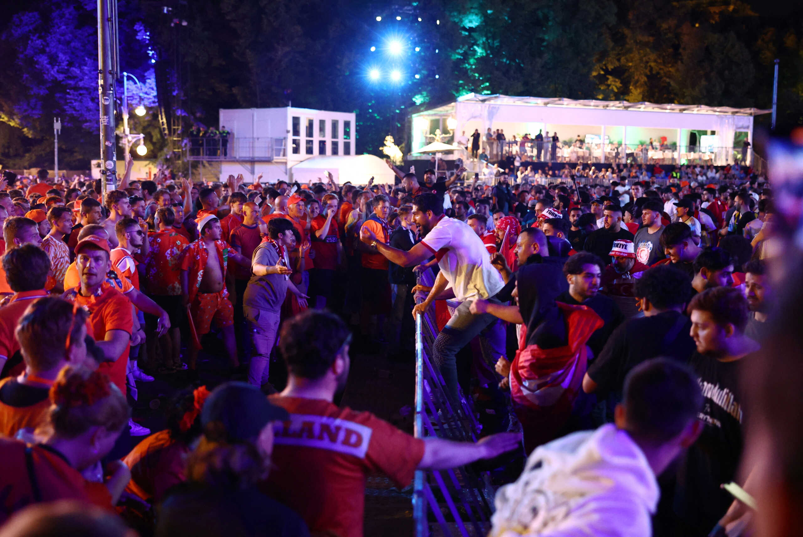 Soccer Football - Euro 2024 - Fans gather for Netherlands v Turkey - Berlin, Germany - July 6, 2024 Turkey and Netherlands fans clash as watch the match in a fanzone at the Brandenburg gate in Berlin REUTERS