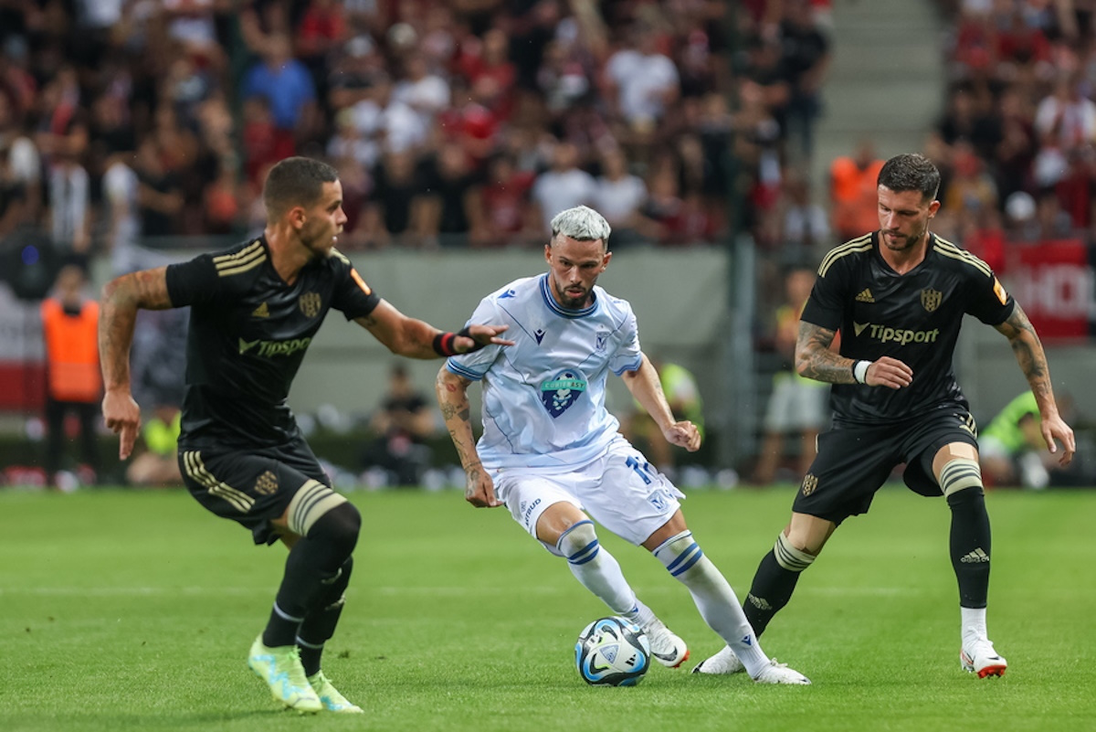 epa10804879 Lech's player Kristoffer Velde (C) and Adrian Zeljkovic (L) and Kristian Kostrna (R) of Spartak Trnava in action during the UEFA Europa Conference League third qualifying round second leg soccer match between Spartak Trnava vs Lech Poznan in Trnava, Slovakia, 17 August 2023.  EPA