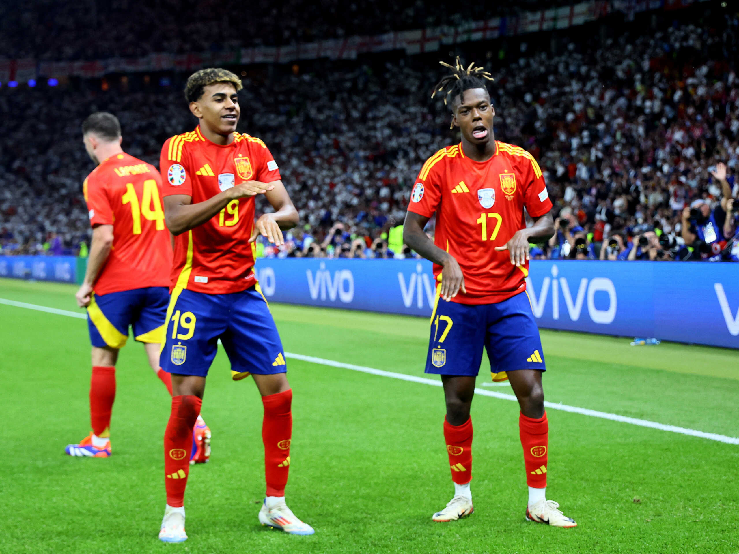 Soccer Football - Euro 2024 - Final - Spain v England - Berlin Olympiastadion, Berlin, Germany - July 14, 2024 Spain's Nico Williams celebrates scoring their first goal Lamine Yamal REUTERS