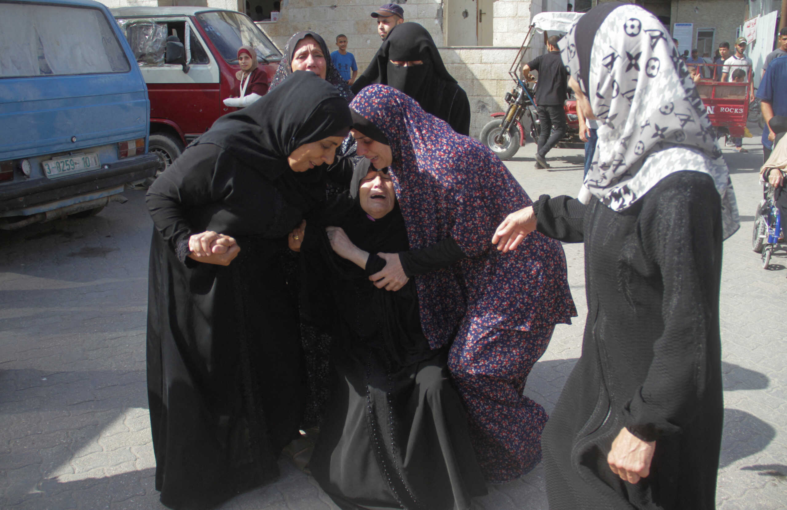 People react as Palestinians were killed in an Israeli strike on a school sheltering displaced people, amid the Israel-Hamas conflict in Gaza City August 10, 2024. REUTERS
