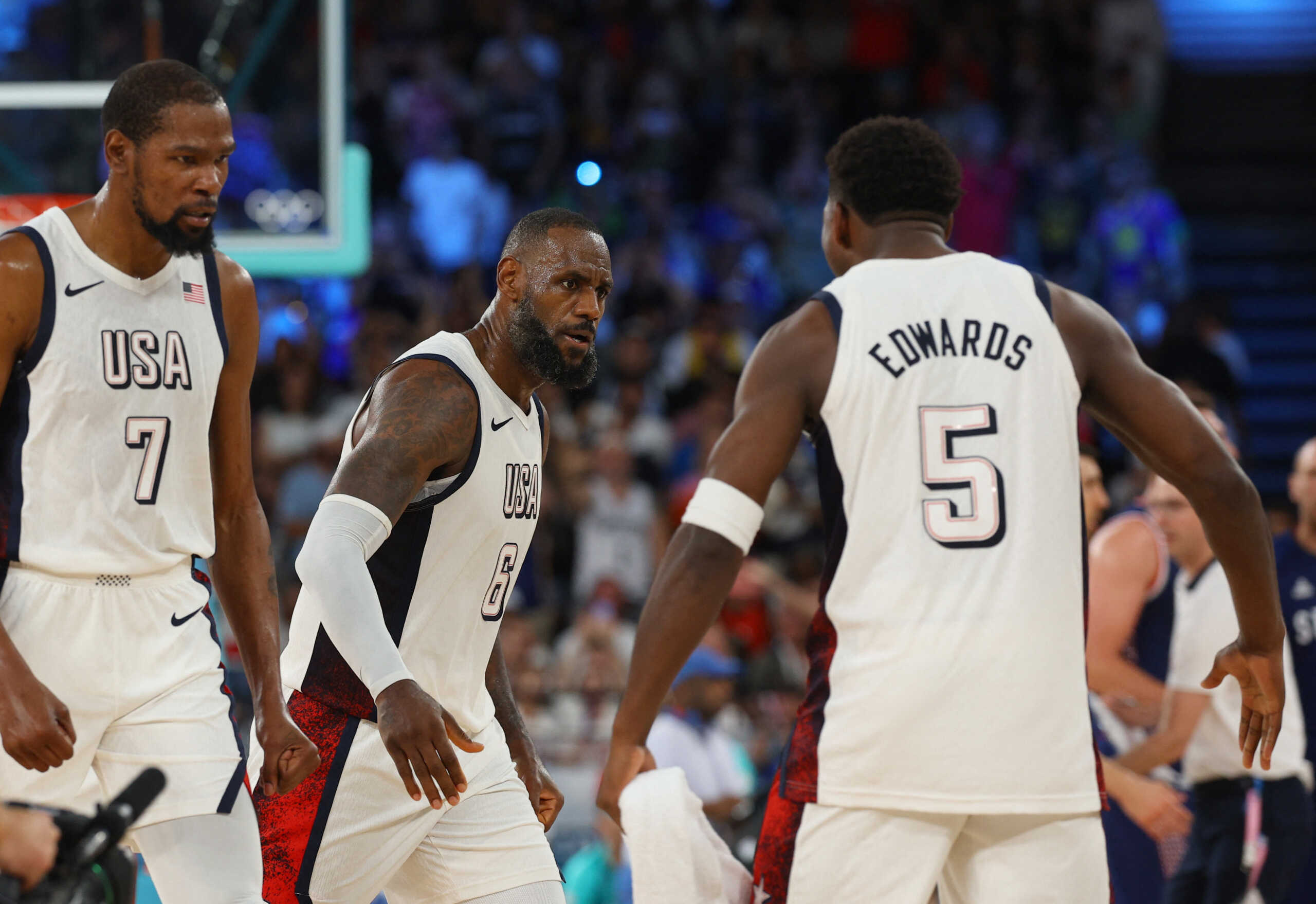 Paris 2024 Olympics - Basketball - Men's Semifinal - United States vs Serbia - Bercy Arena, Paris, France - August 08, 2024. Lebron James of United States, Kevin Durant of United States and Anthony Edwards of United States react. REUTERS