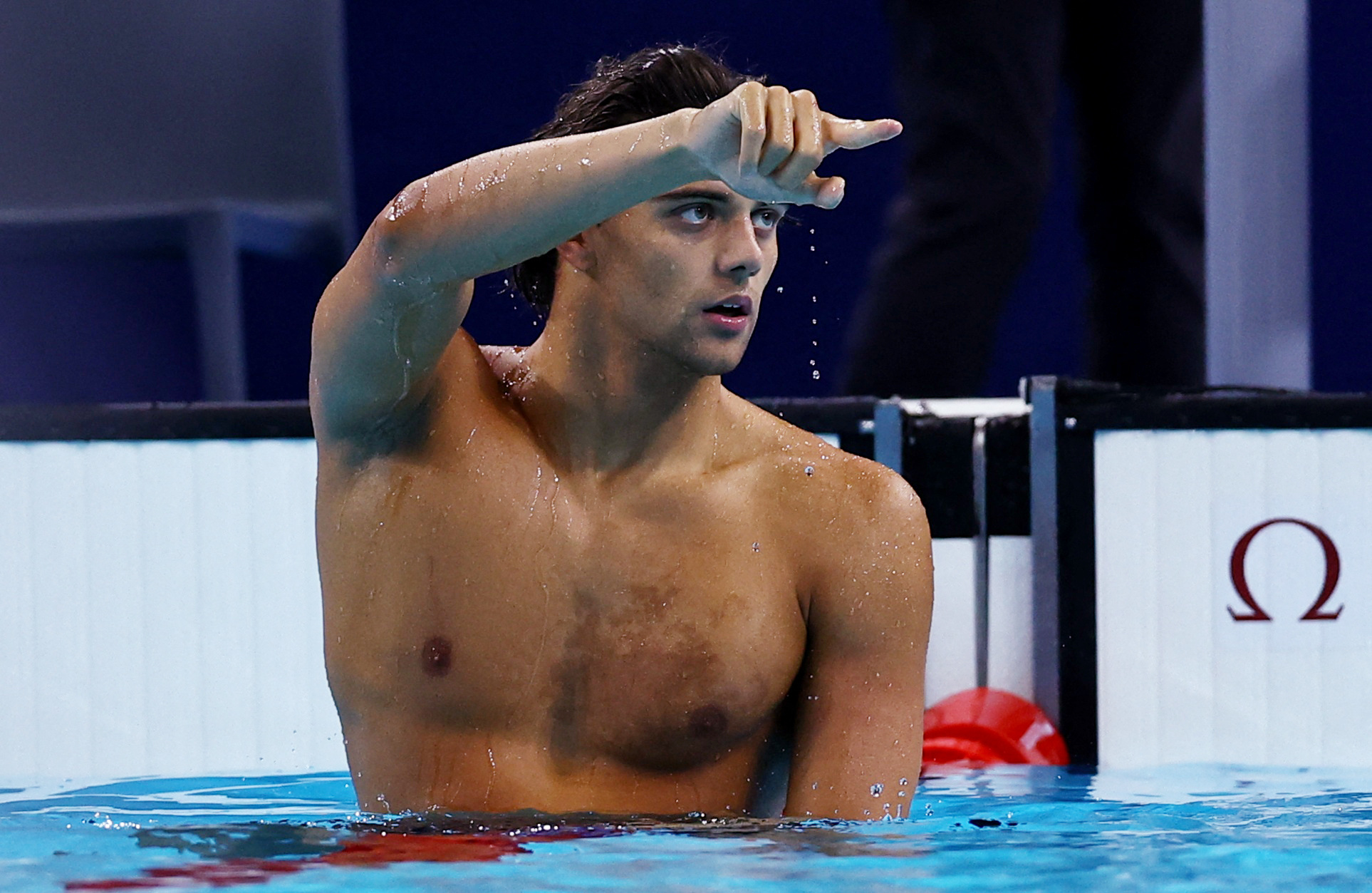 Paris 2024 Olympics - Swimming - Men's 100m Backstroke Final - Paris La Defense Arena, Nanterre, France - July 29, 2024. Thomas Ceccon of Italy reacts after winning the race. REUTERS