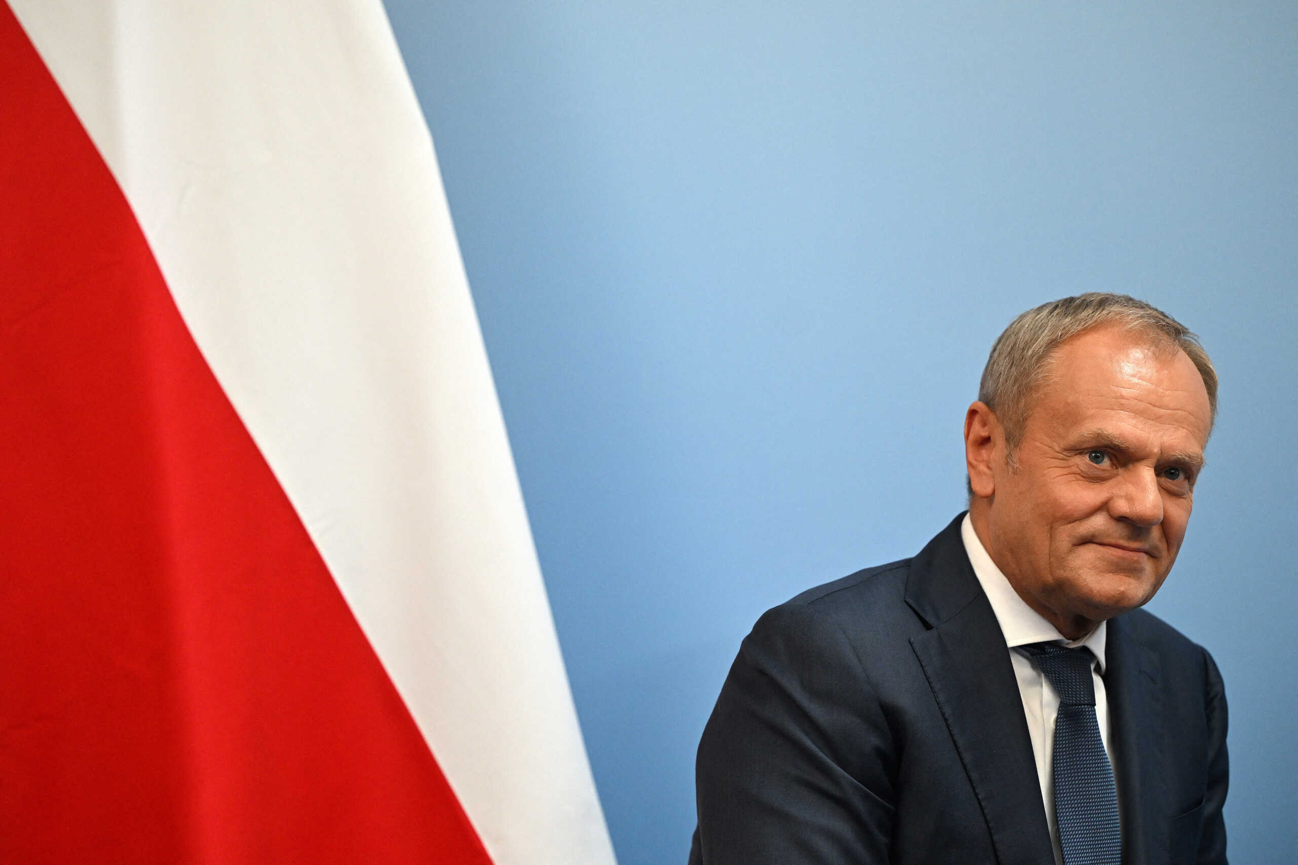Poland's Prime Minister Donald Tusk reacts during a UK Bilateral meeting with Britain's Prime Minister Keir Starmer, at the European Political Community meeting, at Blenheim Palace in Woodstock, Britain, on July 18, 2024.     JUSTIN TALLIS