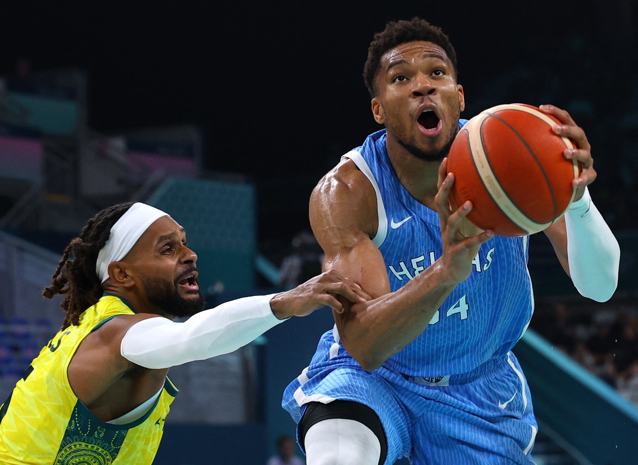 Paris 2024 Olympics - Basketball - Men's Group Phase - Group A - Australia vs Greece - Lille, Pierre Mauroy Stadium, Villeneve-d'Ascq, France - August 02, 2024. Giannis Antetokounmpo of Greece in action against Patty Mills of Australia REUTERS
