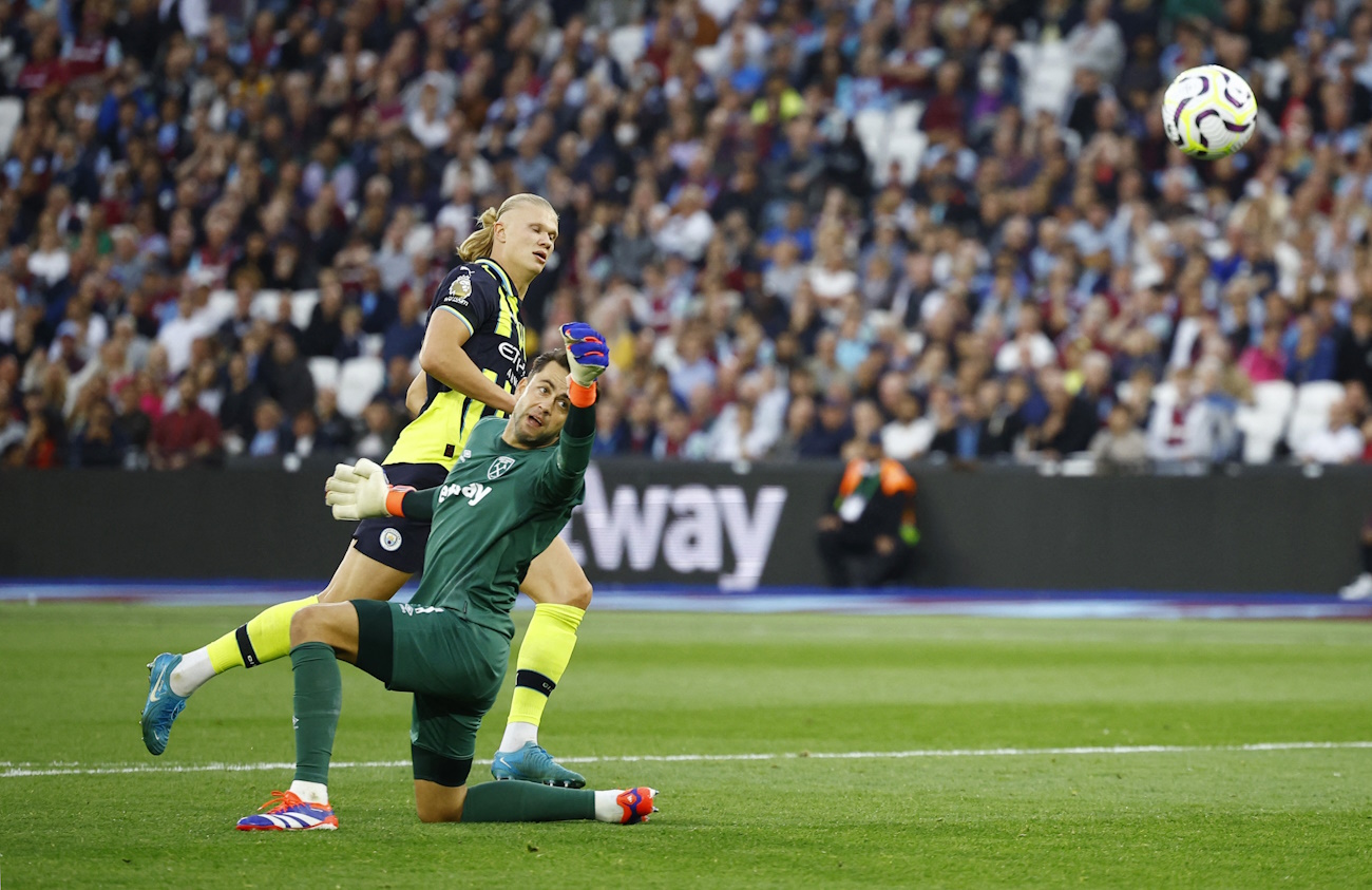 Soccer Football - Premier League - West Ham United v Manchester City - London Stadium, London, Britain - August 31, 2024 Manchester City's Erling Haaland scores their third goal to complete a hat-trick Action Images via Reuters