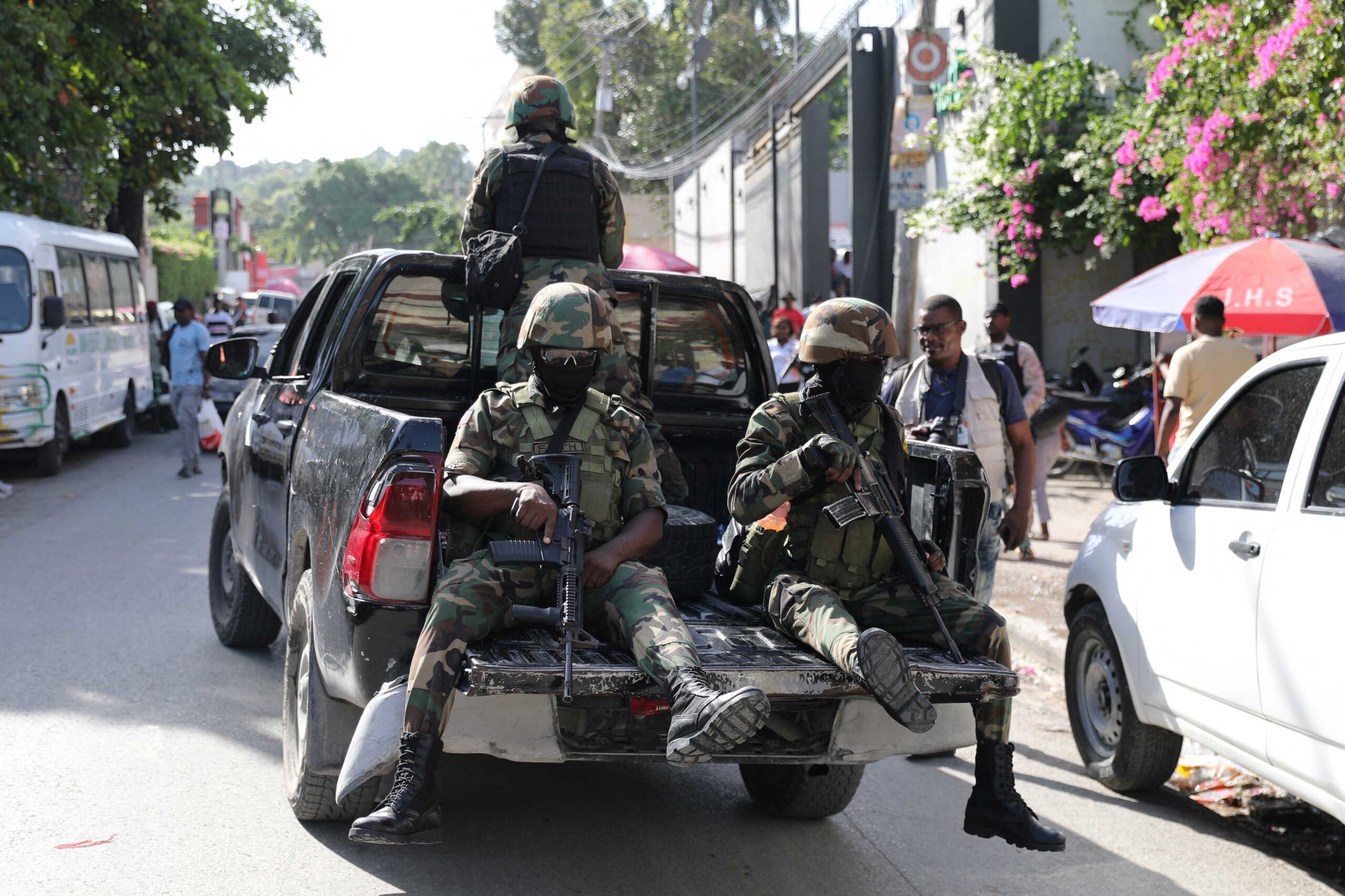 Haitian security forces patrol outside the Canado-Haitien College before the arrival of Prime Minister Garry Conilleas, as part of a State inspection of schools during the final bachelors degree exams, in Port-au-Prince, Haiti August 6, 2024. REUTERS