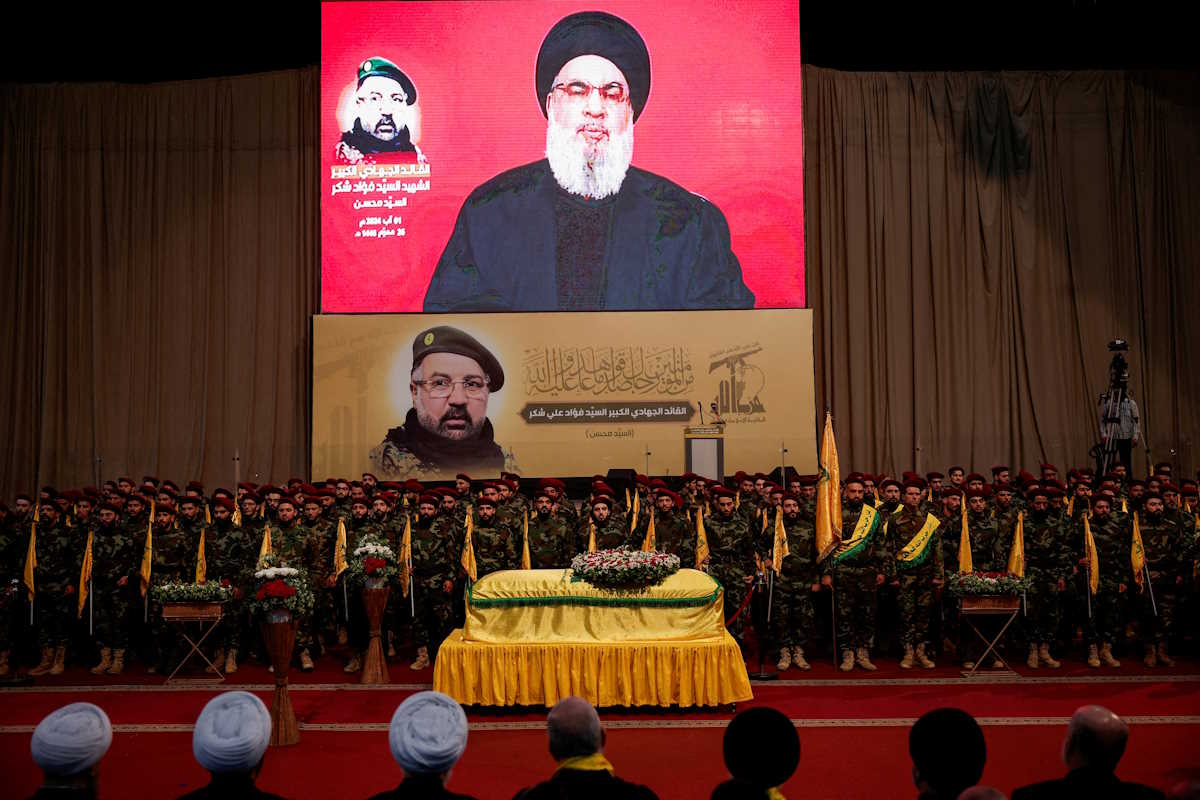 Lebanon's Hezbollah leader Sayyed Hassan Nasrallah appears on a screen as he addresses his supporters, during the funeral of Hezbollah senior commander Fuad Shukr, who was killed in an Israeli strike, in Beirut's southern suburbs, Lebanon August 1, 2024. REUTERS