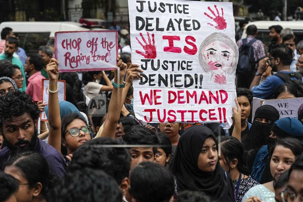 Activists of humanitarian organisations, students of different colleges shout slogan as they participate in a protest rally condemning a brutal rape and murder of a 31 year old post-graduate trainee (PGT) doctor inside a government hospital, demanding exemplary punishment of the culprits involved in the crime, in Kolkata, India, Wednesday, Aug. 14, 2024. (AP Photo